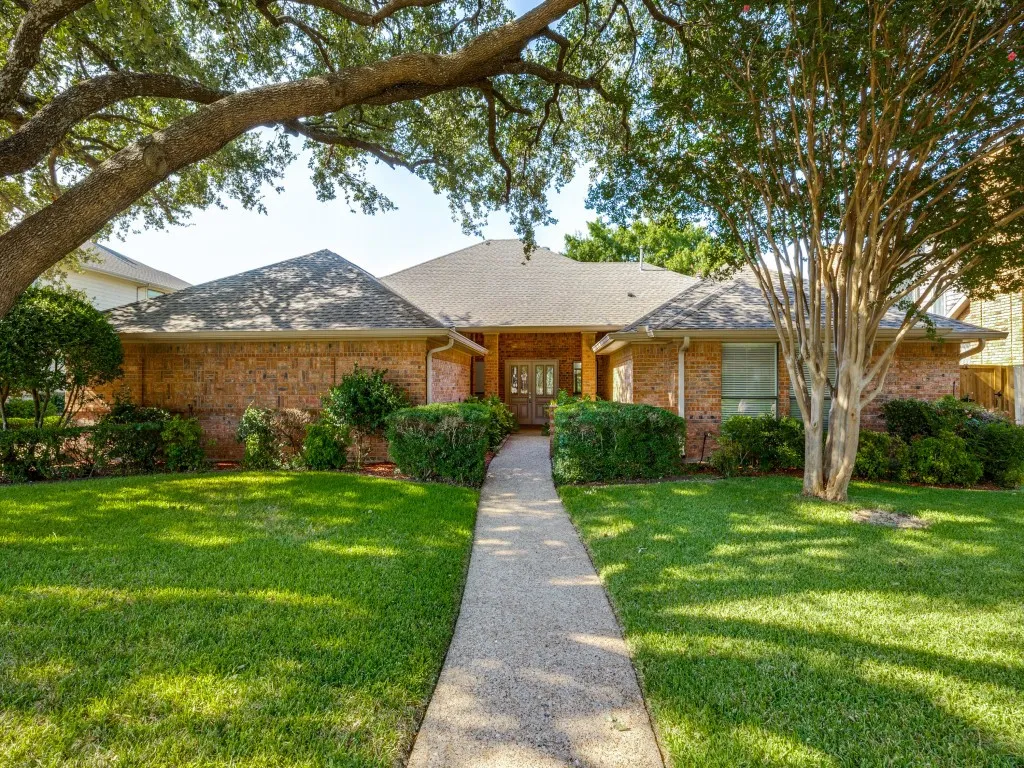 Beautiful one story brick home on the golf course in quiet neighborhood located just minutes from major highways such as George Bush and Hwy 75.