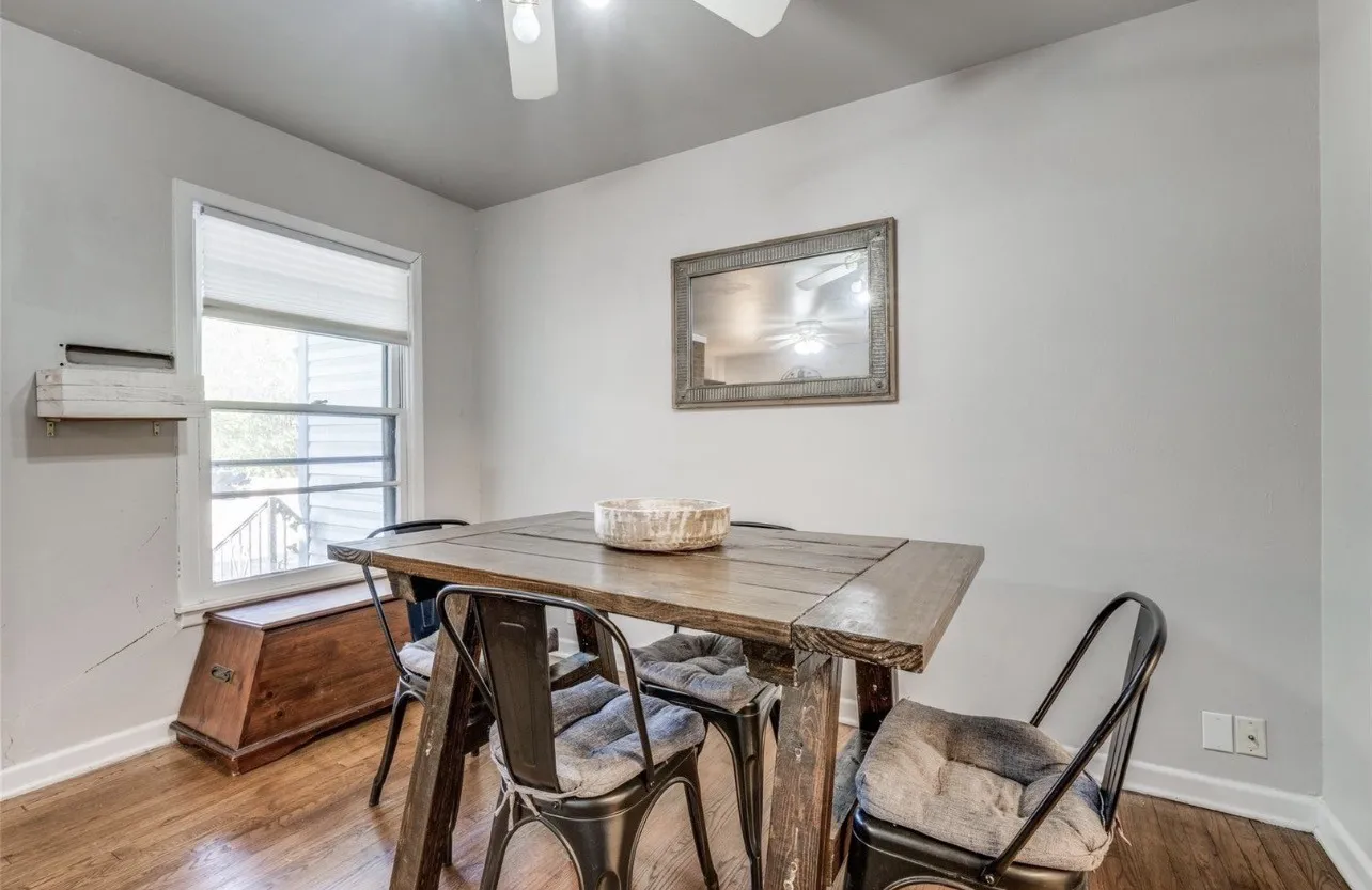 Wood-finish flooring with white baseboards