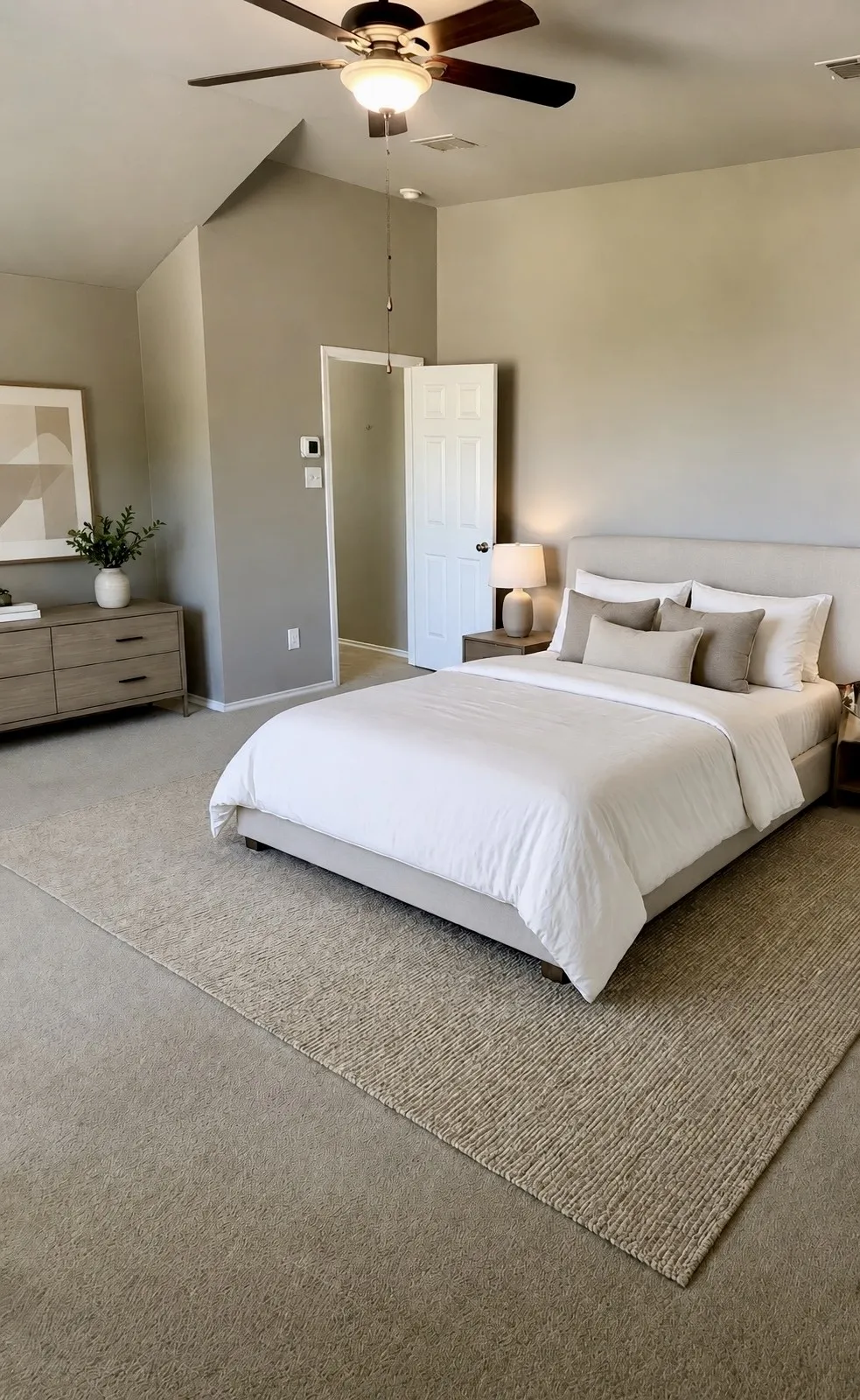 Vaulted ceiling with a ceiling fan, neutral wall tones, and carpet flooring