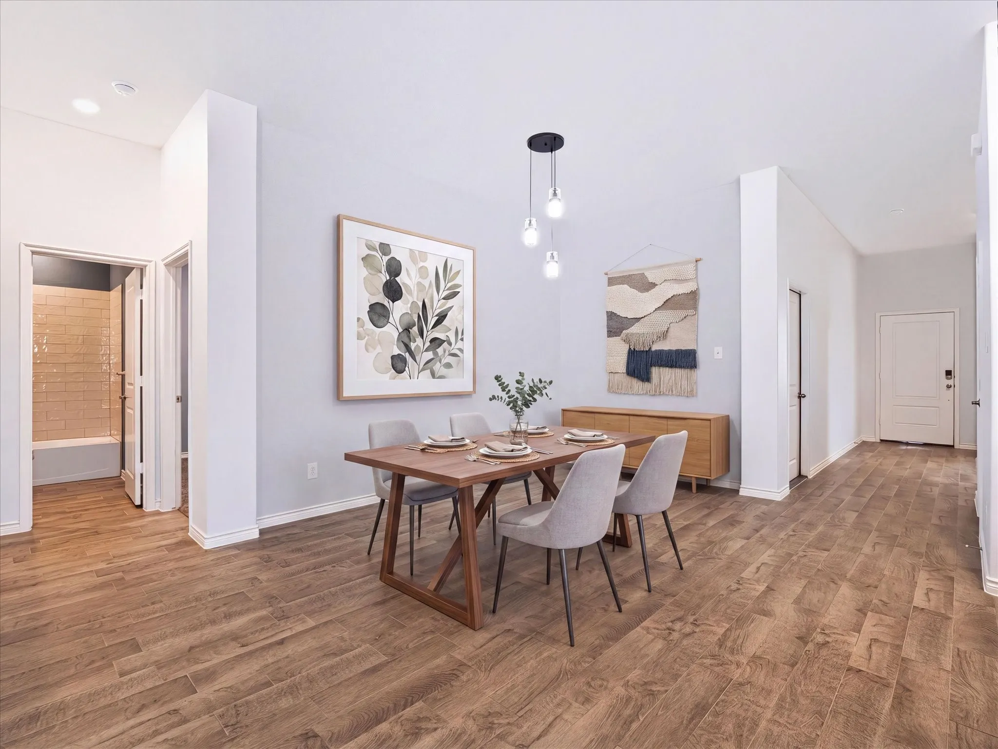 Wood-finish flooring throughout, recessed lighting, and a modern pendant light fixture
