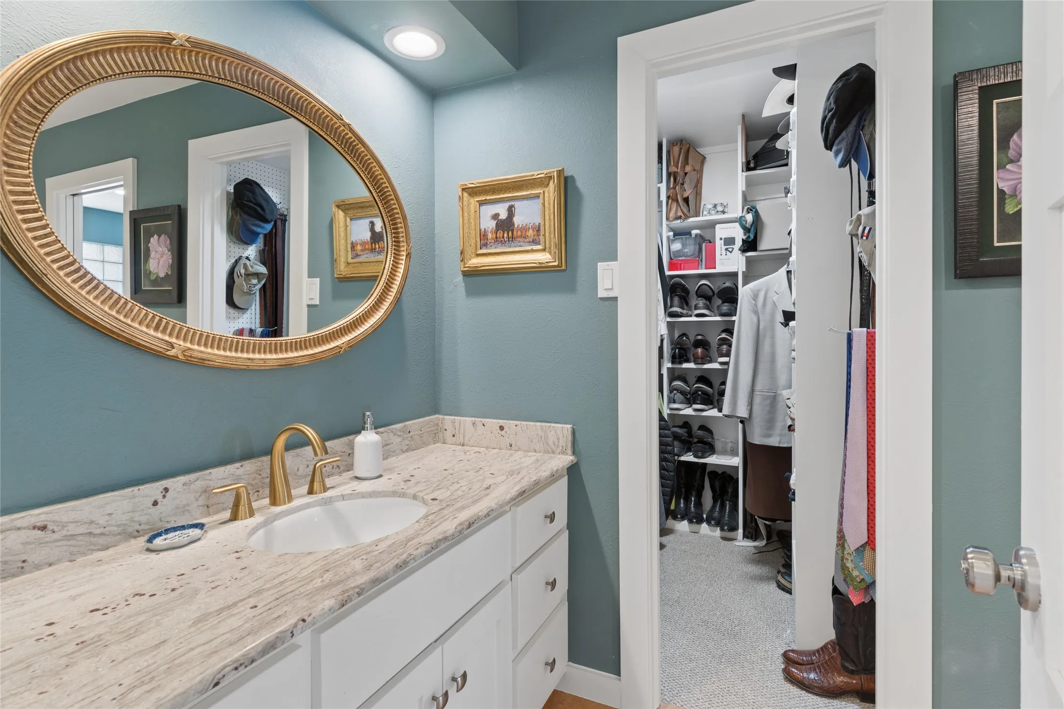 one of two walk-in closets in the primary bath suite