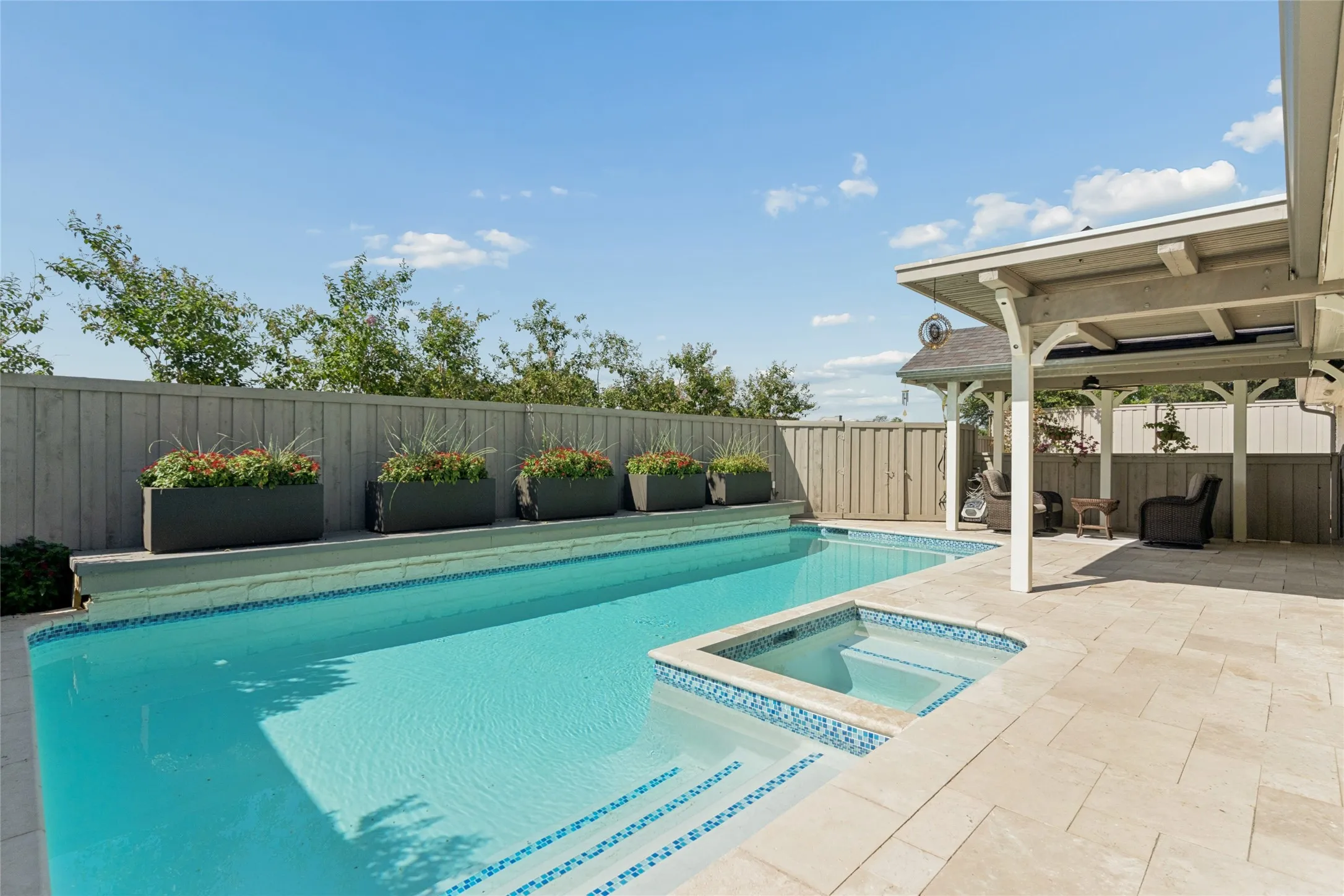 View to the Southwest, with a row of Crepe Myrtles behind the rear fence. Best landscaped alley space in the community.