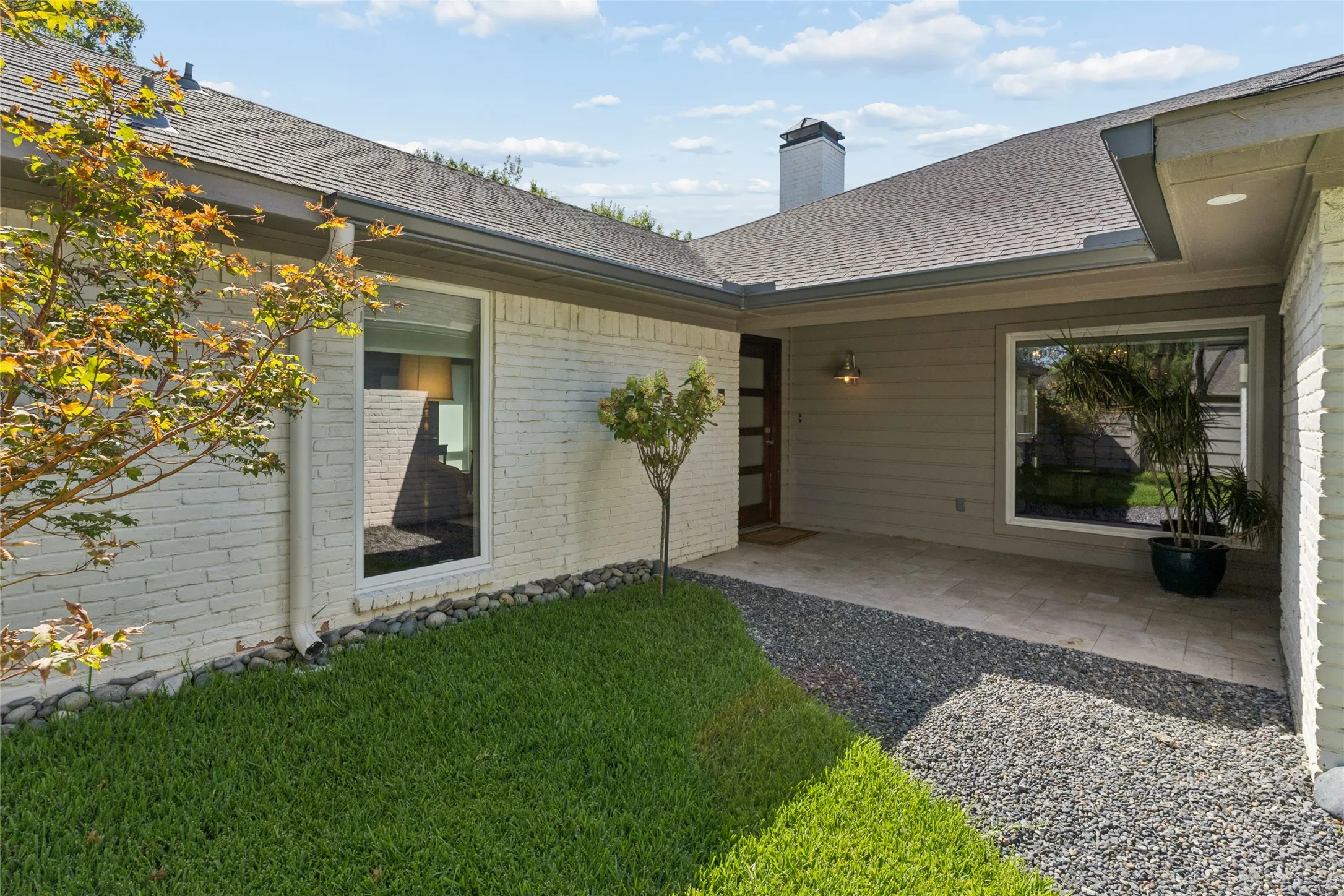 Looking to the front porch and door.