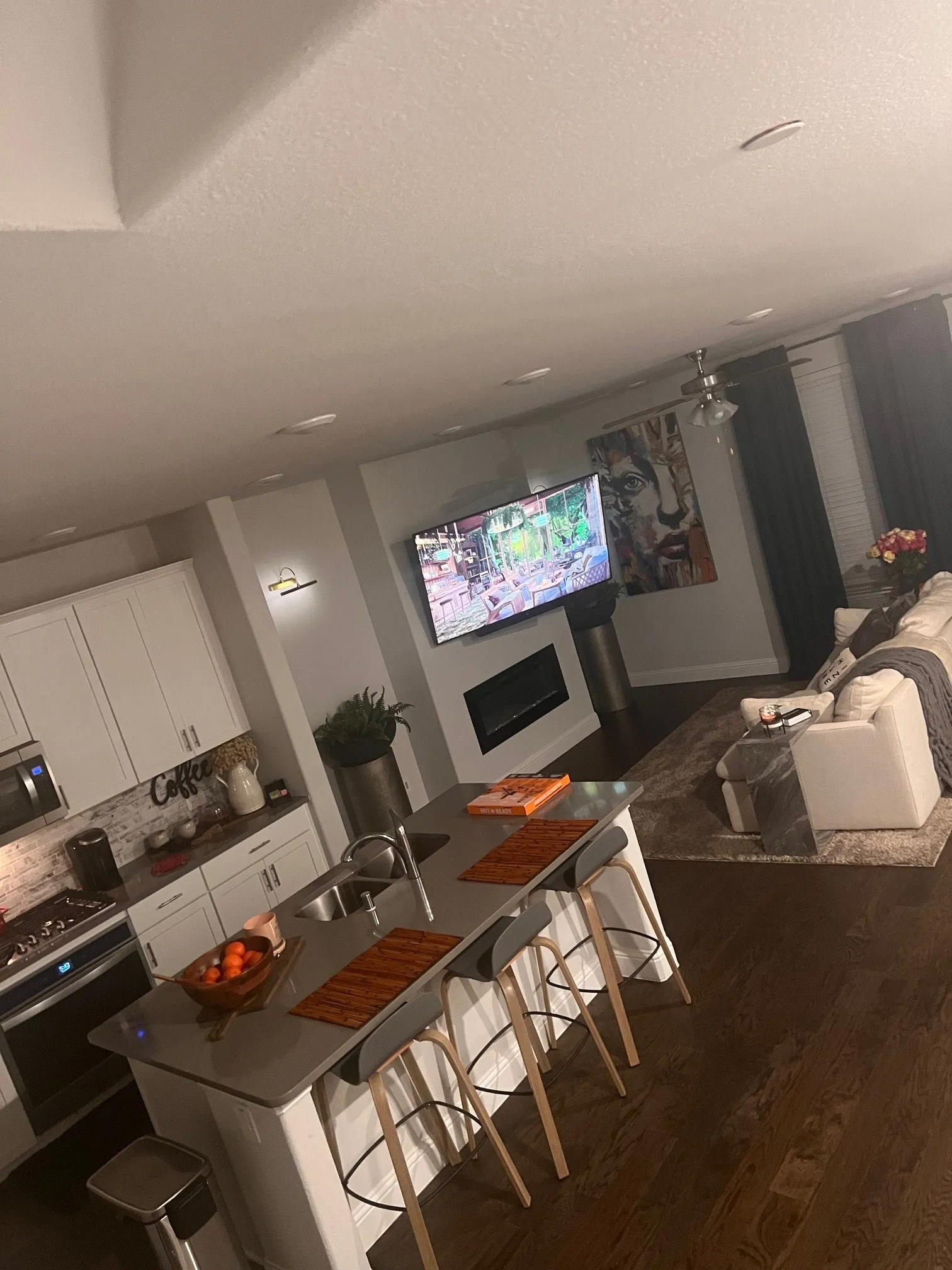 Open concept kitchen flows with living room and dining room.