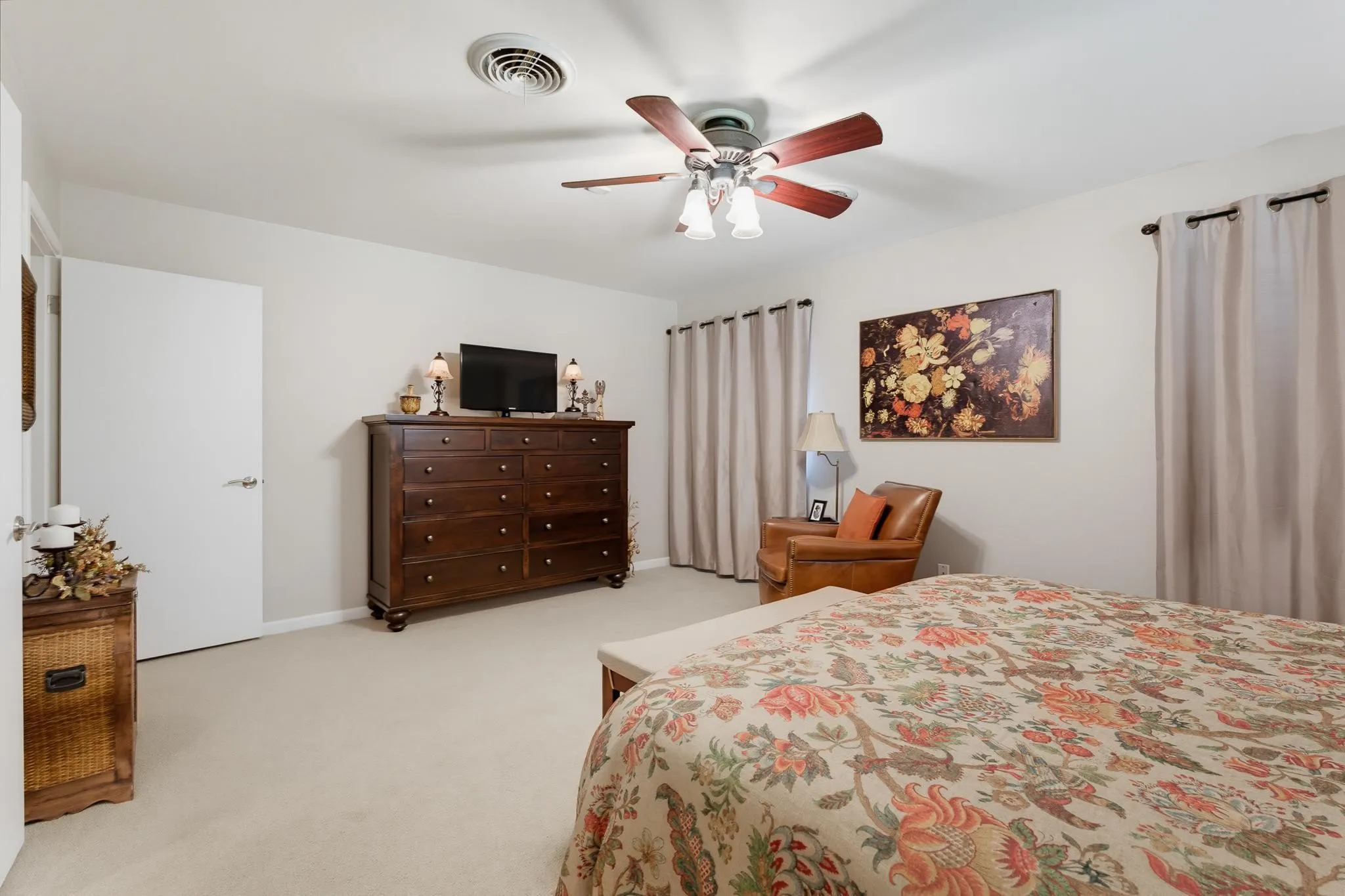 Carpeted flooring, ceiling fan with integrated lighting, and neutral wall tones
