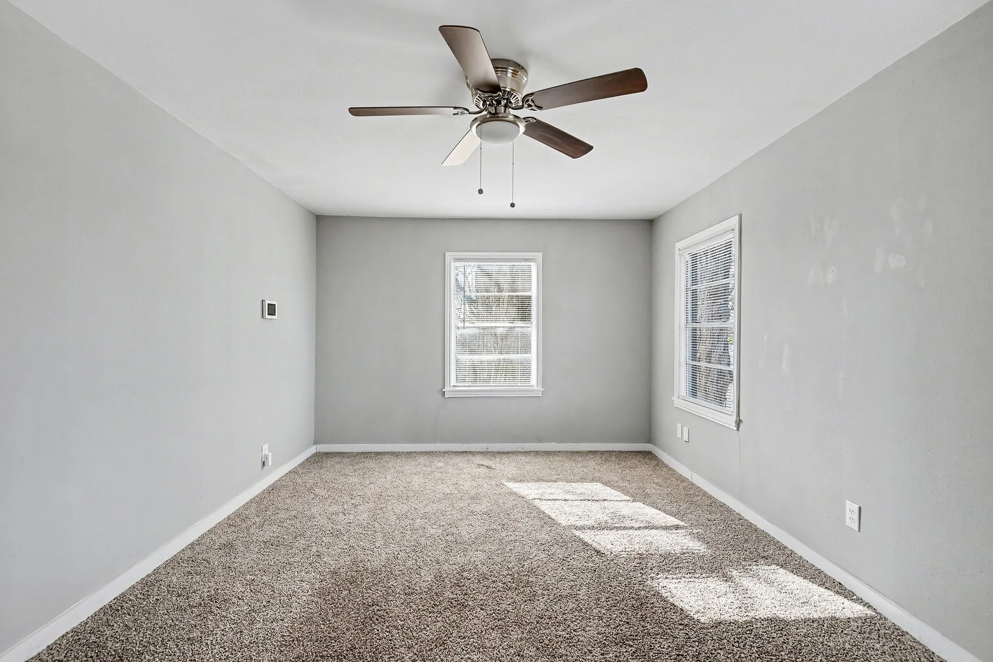 Neutral tone walls with textured carpeting