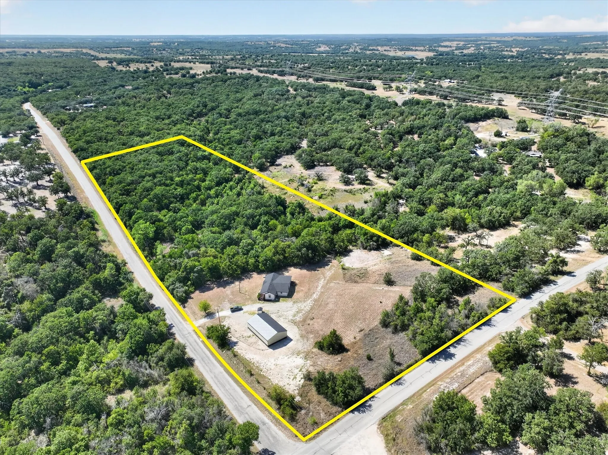 Expansive land parcel with significant tree coverage