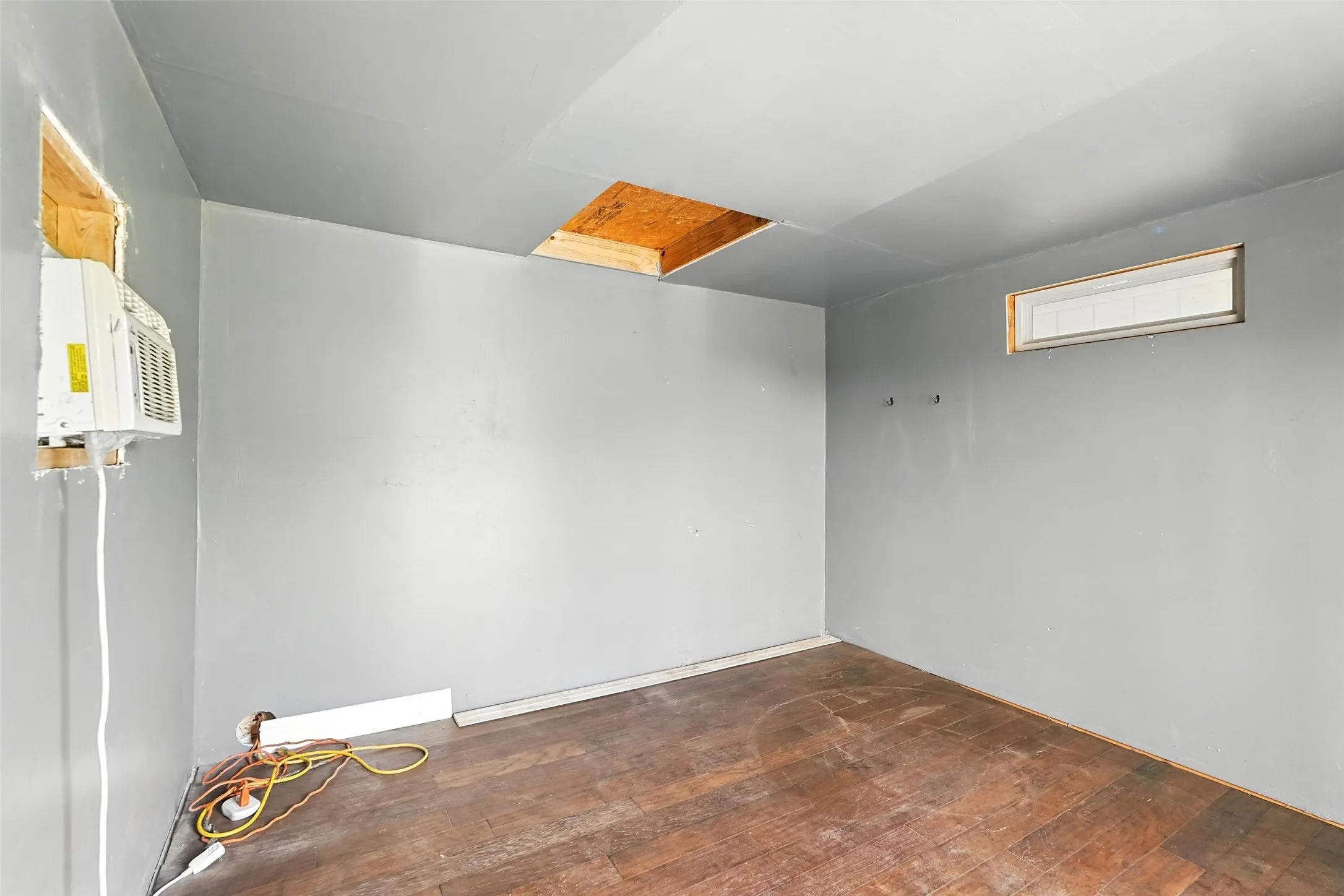Unfurnished room with dark wood finished floors
