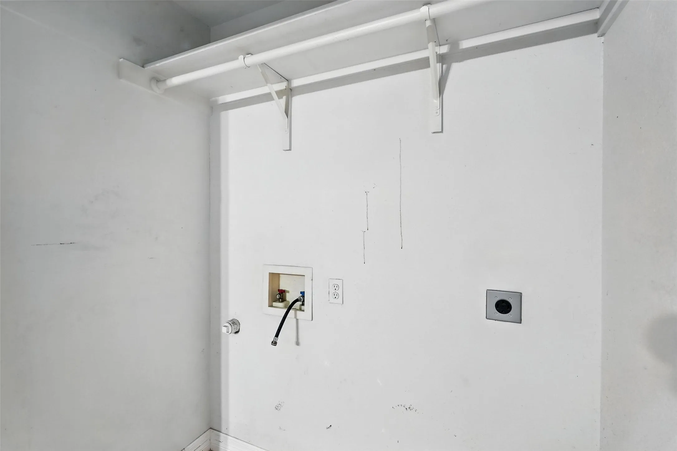 Laundry room featuring electric dryer hookup and hookup for a washing machine