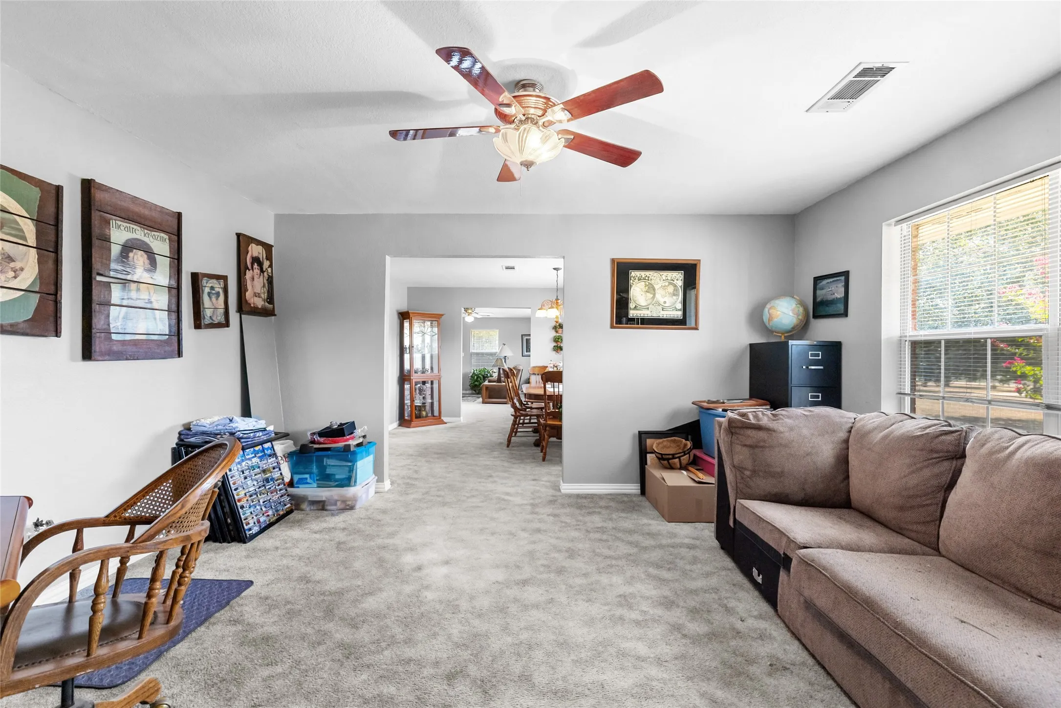 Recessed lighting, ceiling fan, carpeting, window with blinds, and light gray wall paint