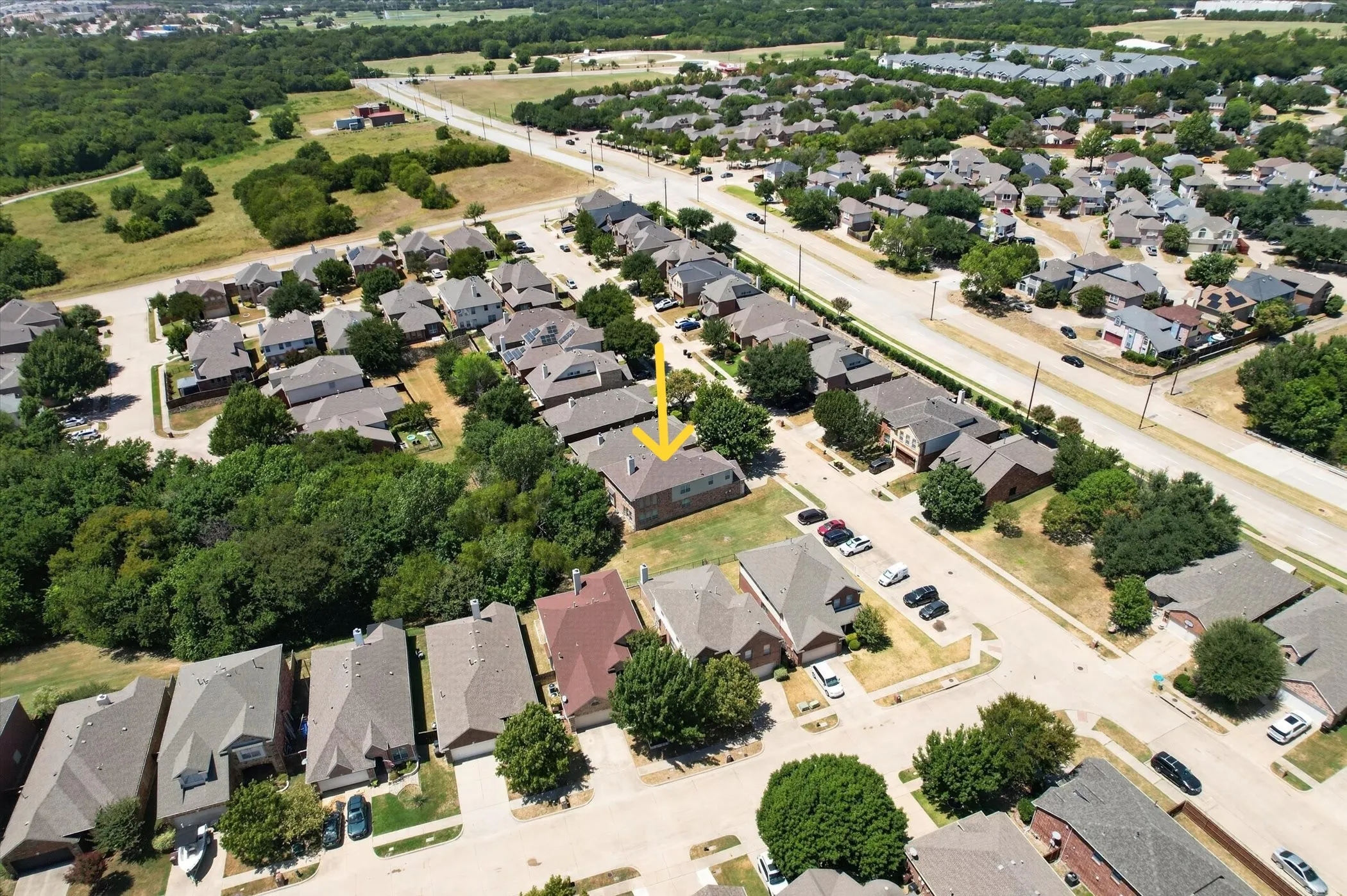 This aerial view shows the home nestled within the neighborhood, with quick access to Hwy. 75 and Allen city limits just across the street.