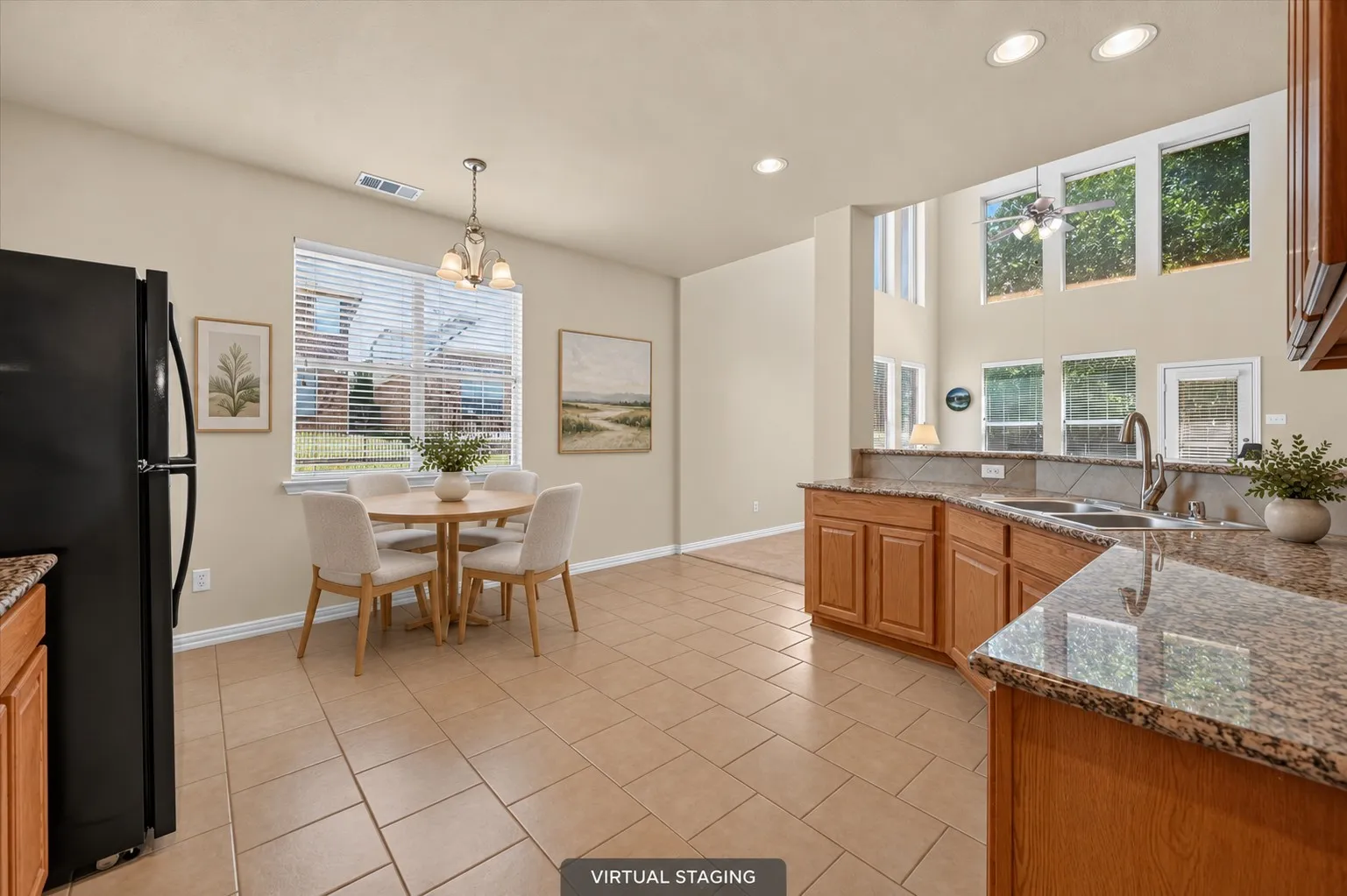 The kitchen opens seamlessly to the living room, creating an inviting layout ideal for entertaining.