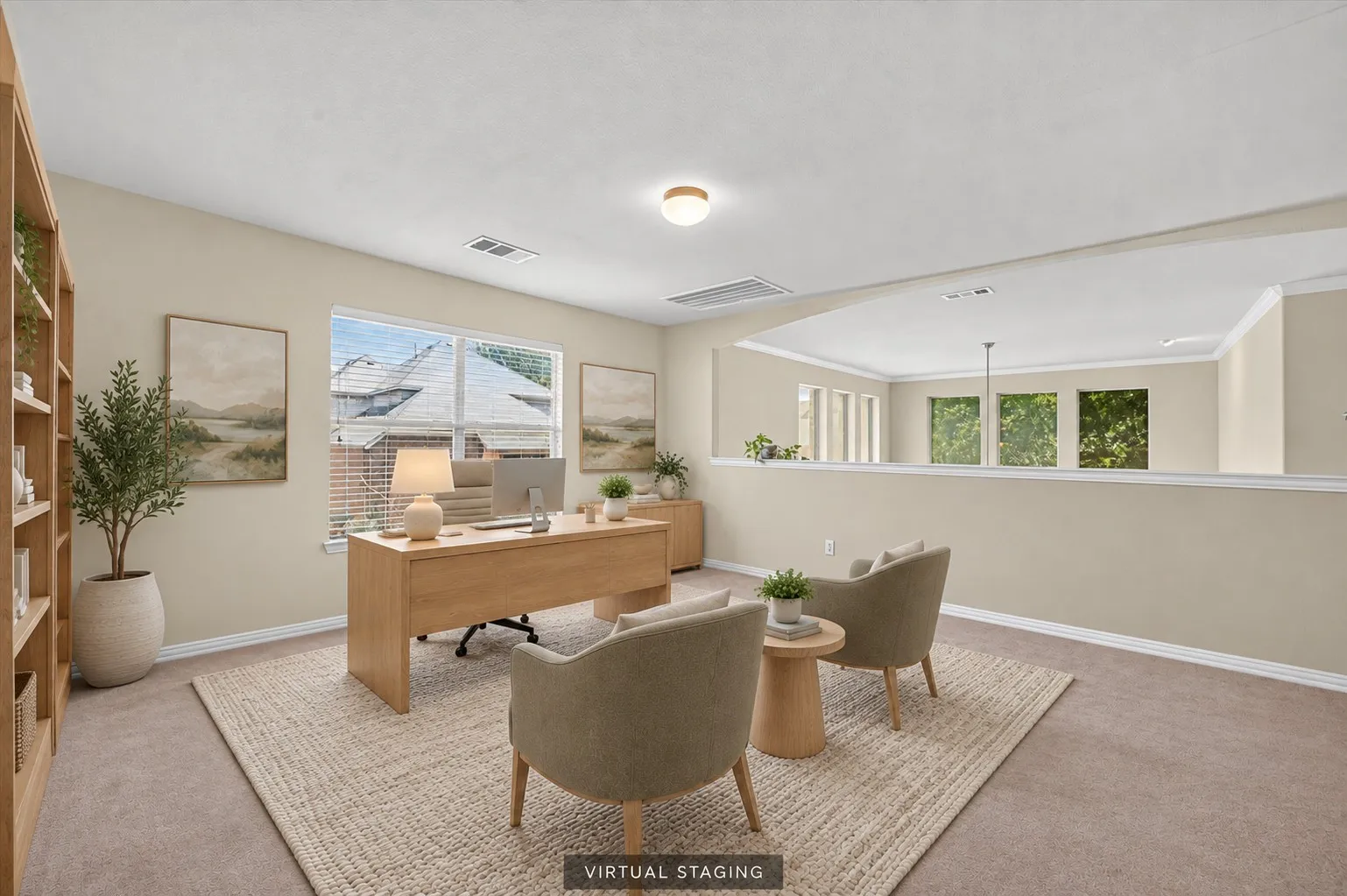 Spacious open-concept bonus room with crown molding overlooks the living area below and offers beautiful views of the surrounding greenspace.