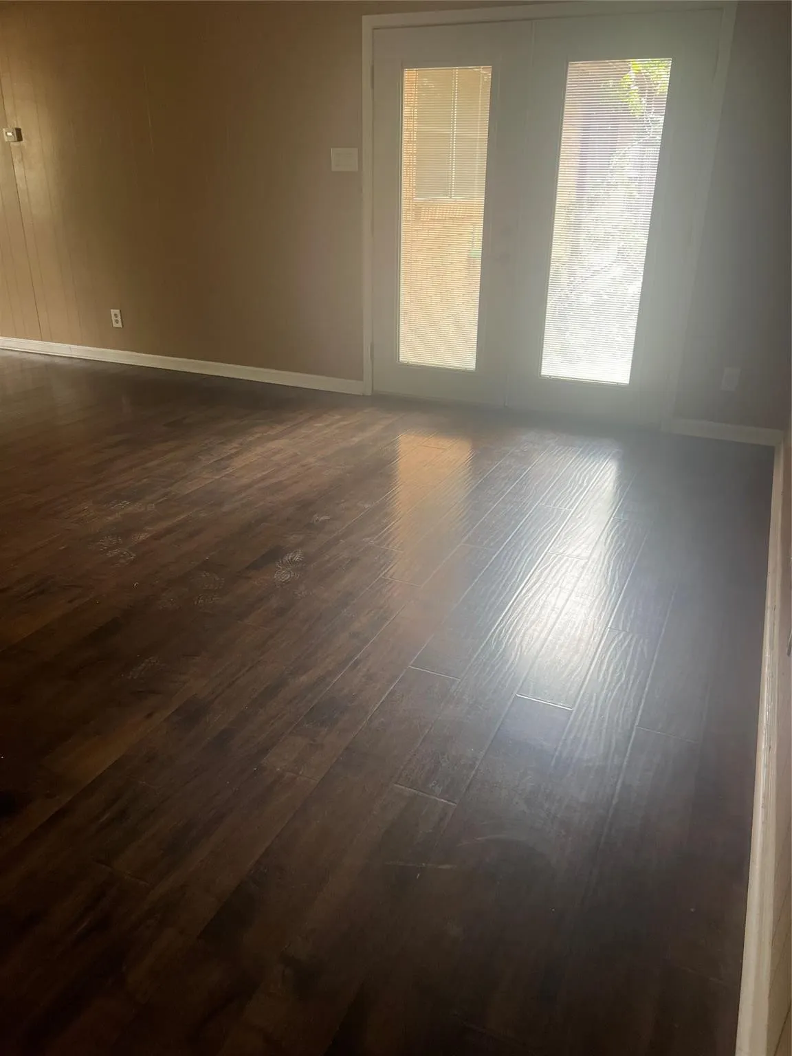 Dark wood-finish flooring with a satin sheen