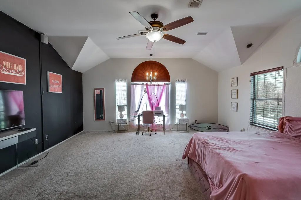 High vaulted ceilings, ceiling fan with integrated lighting, multiple windows with blinds, and recessed lighting
