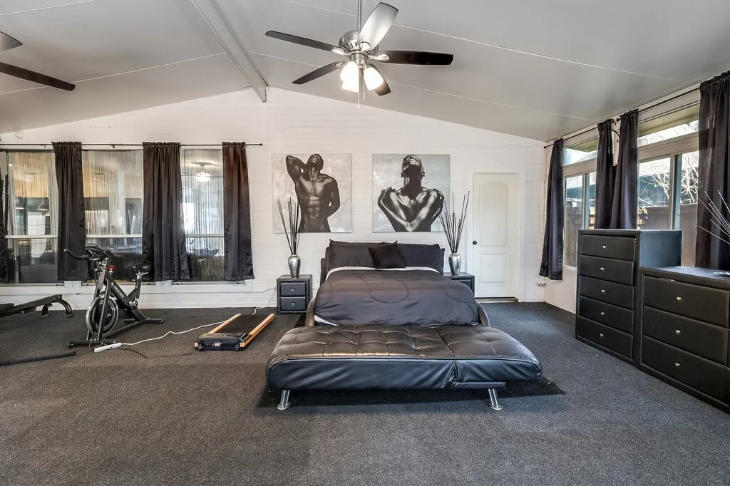Vaulted ceiling with exposed beams, recessed lighting, and multiple ceiling fans