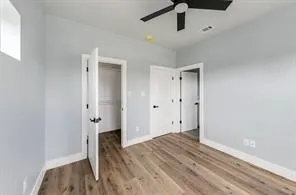 Light-toned walls with wood-finish flooring