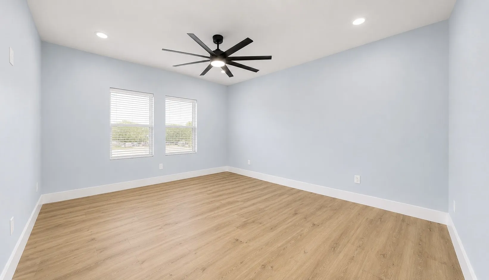 Wood-finish flooring, recessed lighting, and a modern ceiling fan