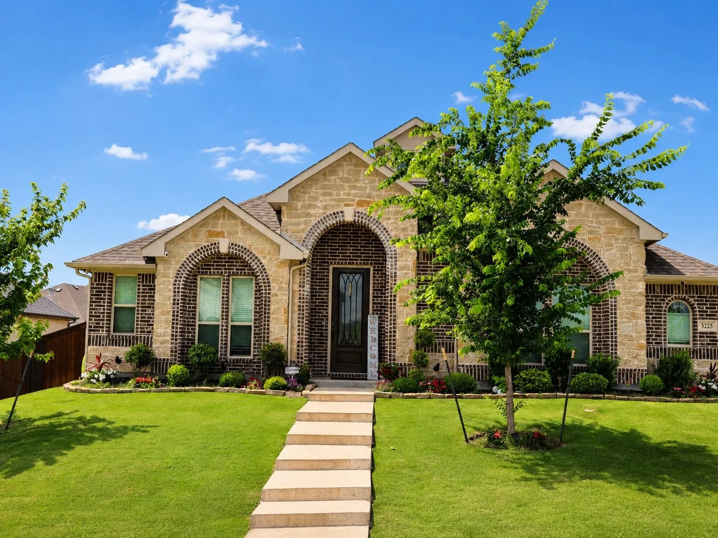 Brick and stone exterior with arched accents