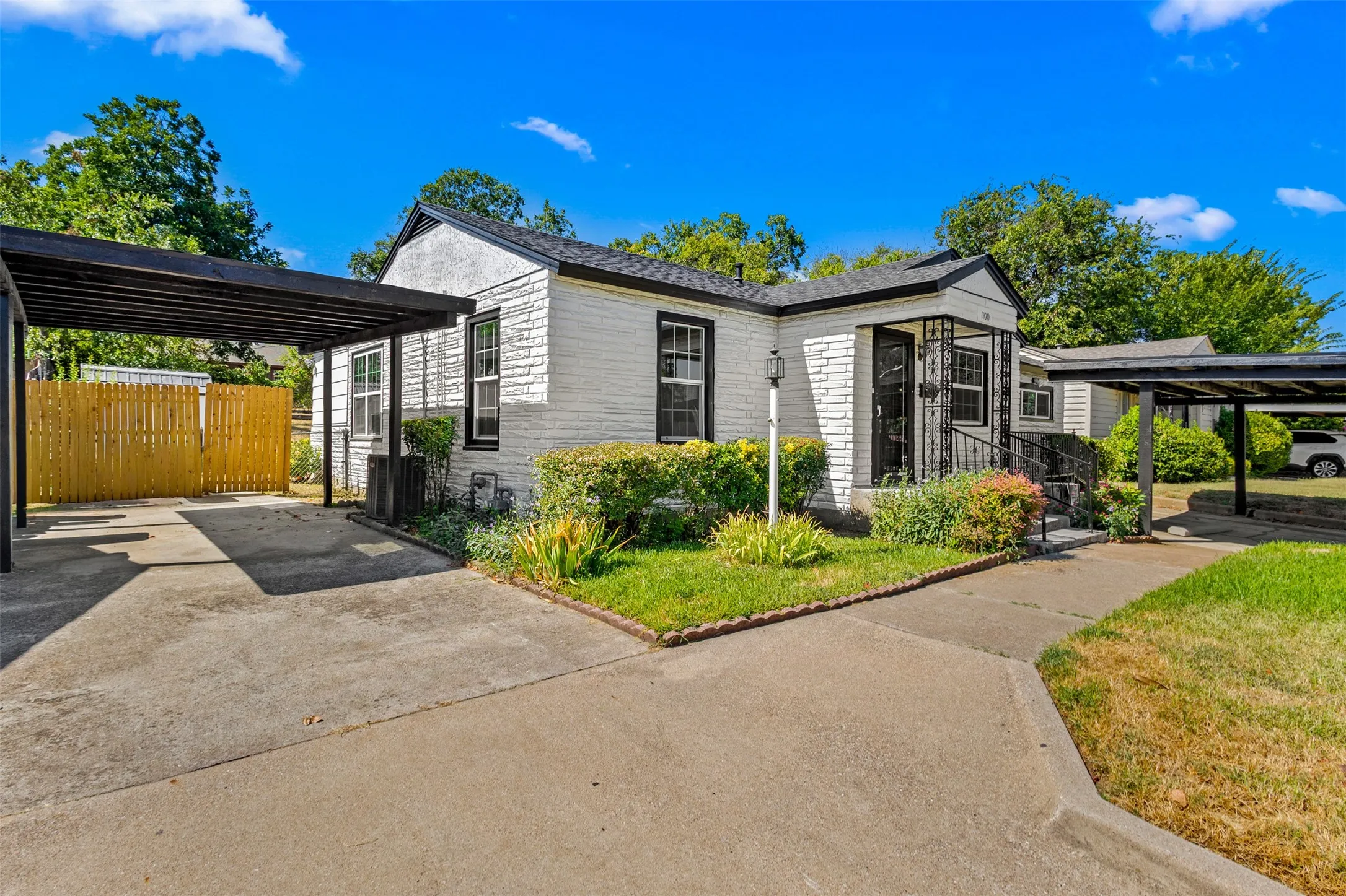 White brick exterior with a covered front entry