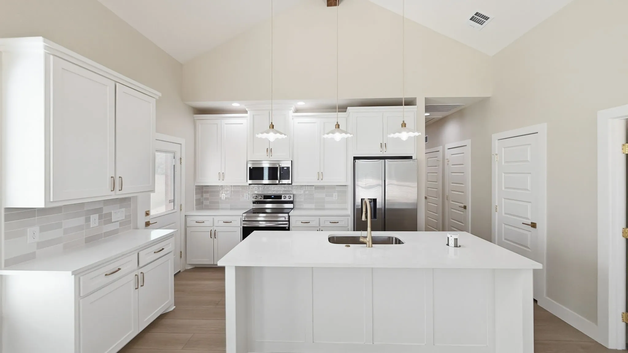 Large kitchen island with quartz countertops