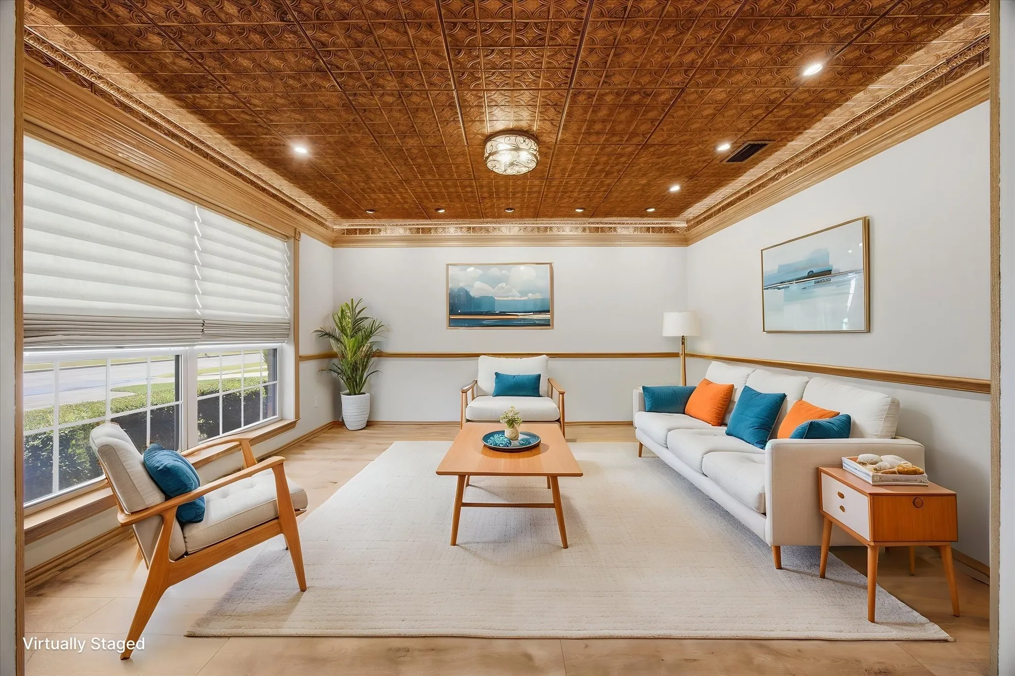 Virtually staged living area showcasing a stunning decorative tin ceiling, rich architectural details, accent lighting, and abundant natural light.  This room could also be an amazing office-study with the rich color tones, accented with the Hunter Douglas Vignette Window Shades with the Lite Rise, Top down, bottom-up shades.