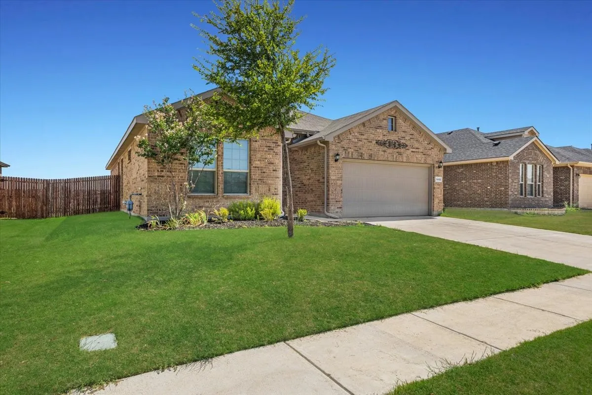 Brick exterior with an attached garage