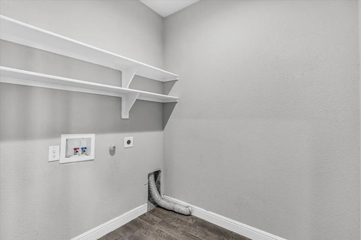 Built-in shelving, wood-finish flooring, washer hook-up, dryer hook-up, and wall outlets