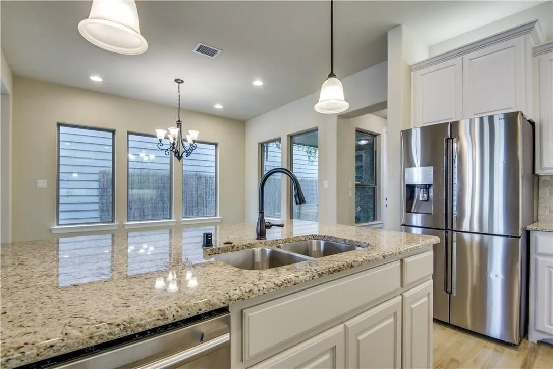 Kitchen island with granite countertops and double basin sink