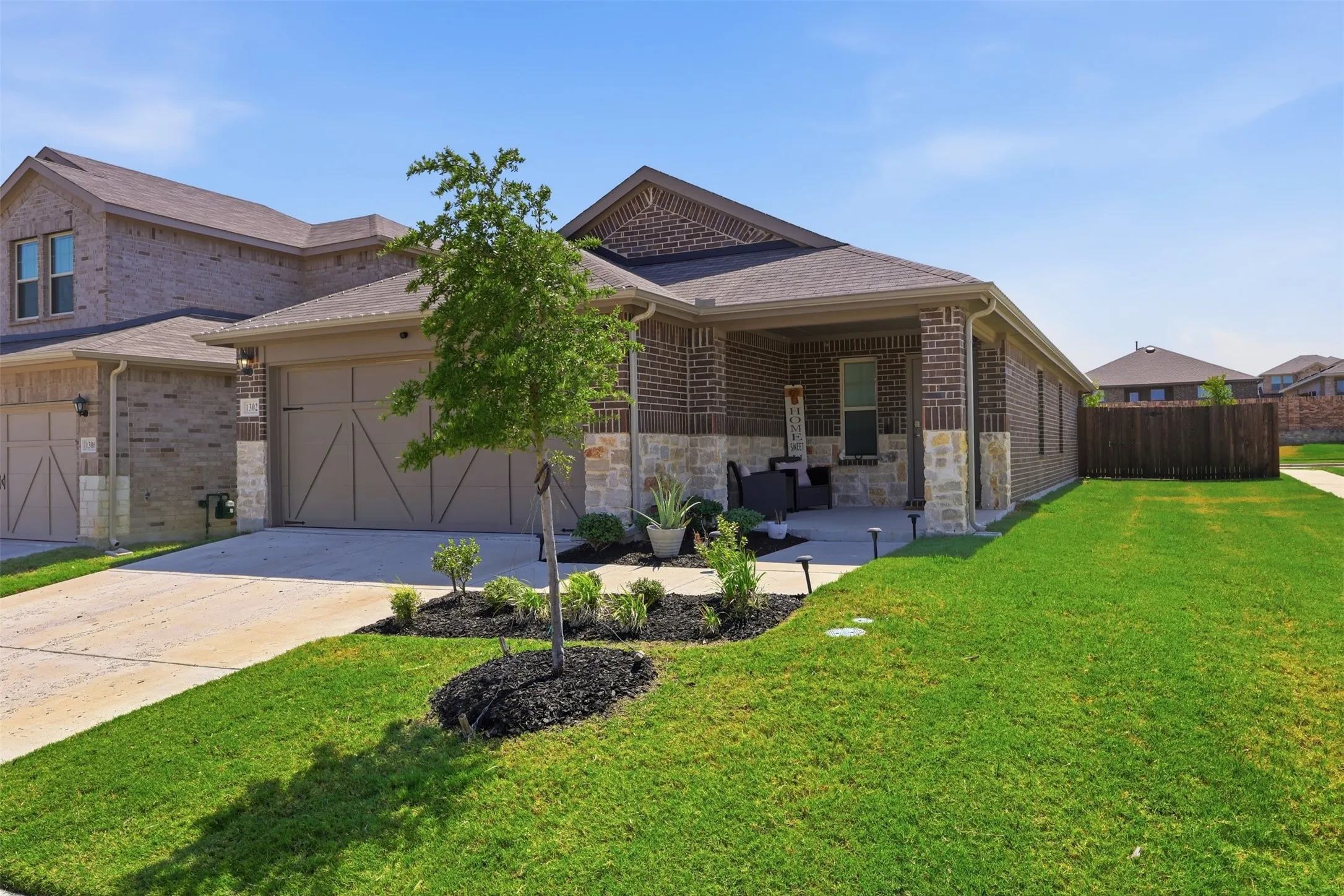 Brick and stone exterior with covered front porch