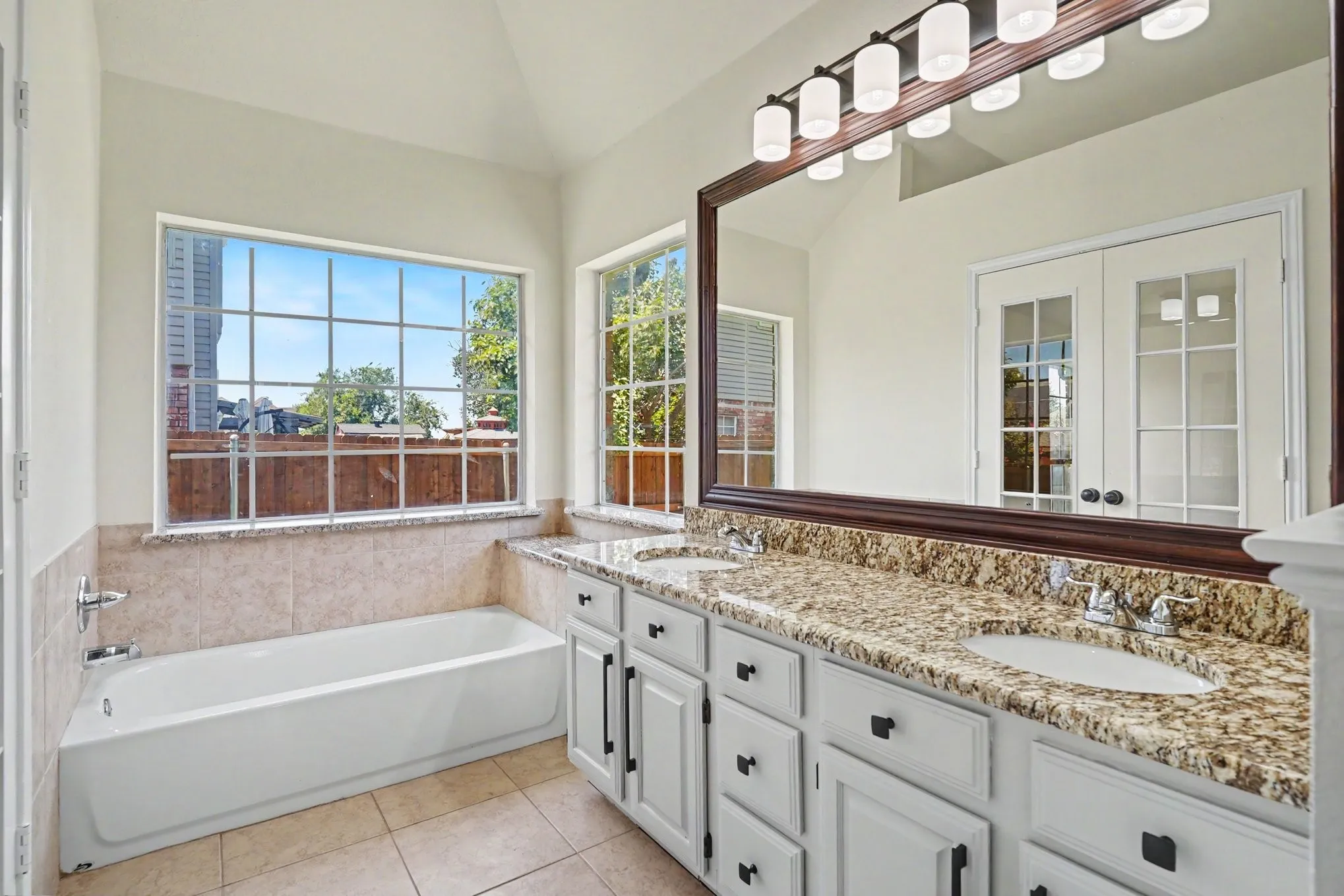 Dual vanity with undermount sinks and stone countertops