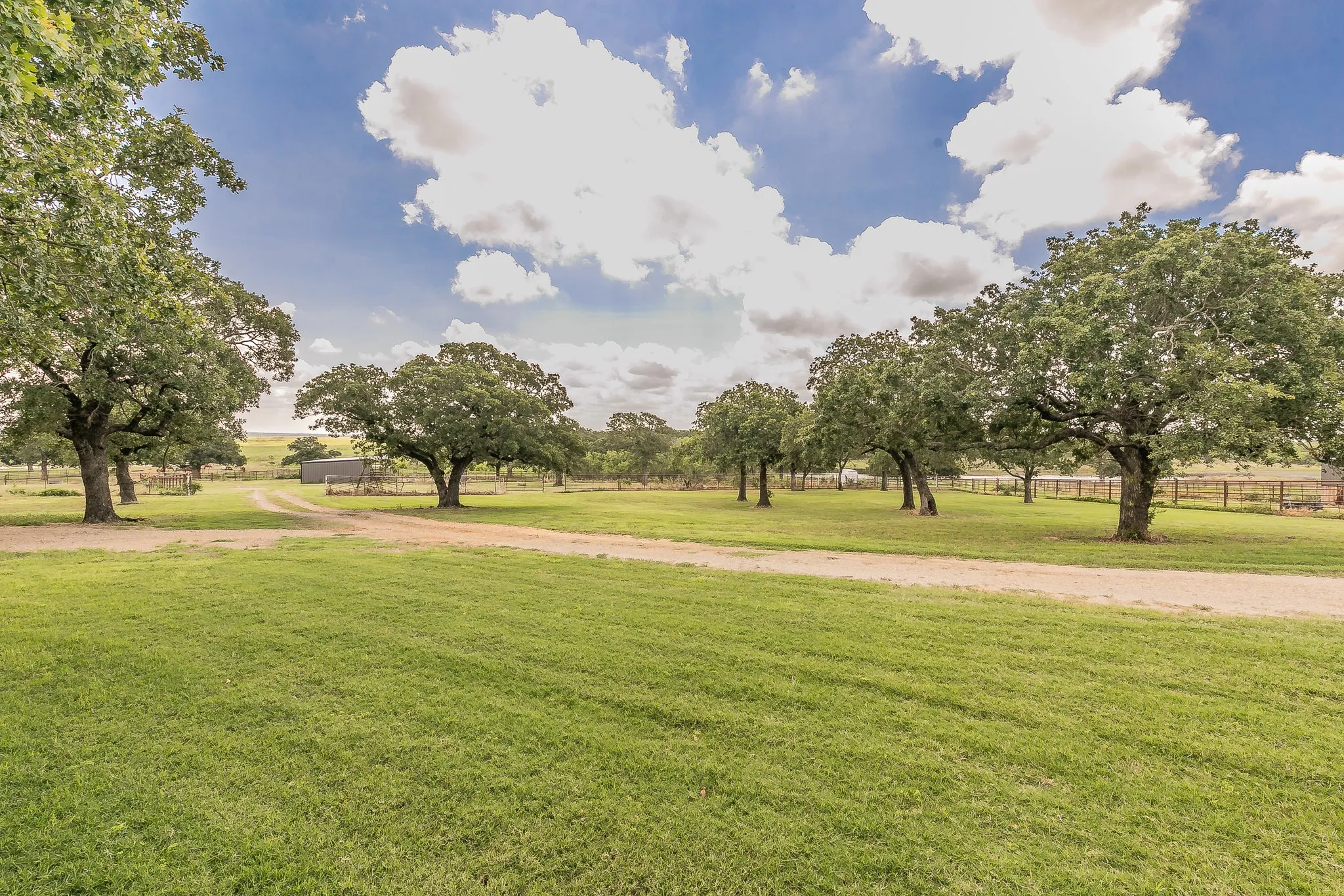 View of property's community featuring a yard and a rural view