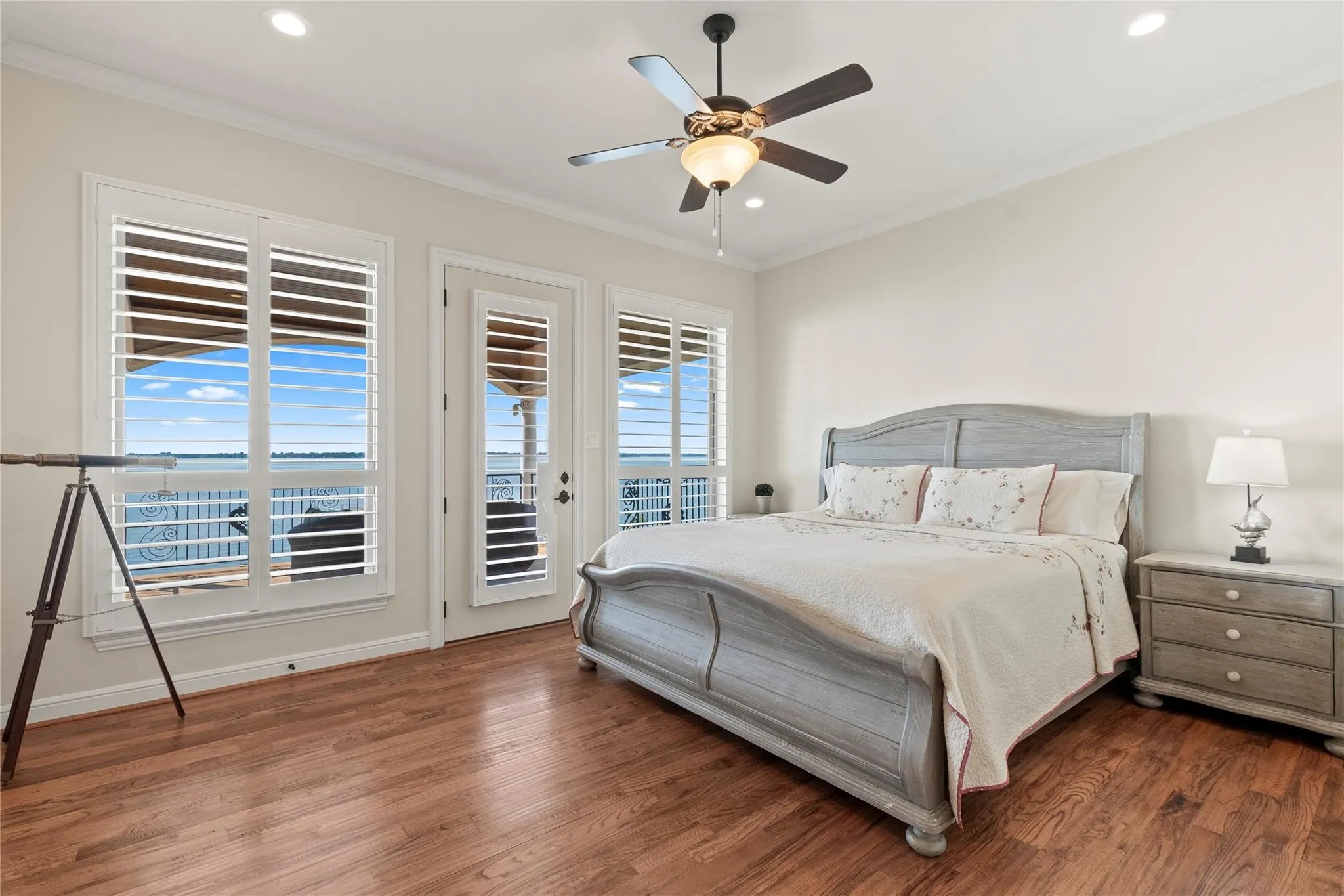 Ensuite bedroom three with balcony access and lovely wood floors