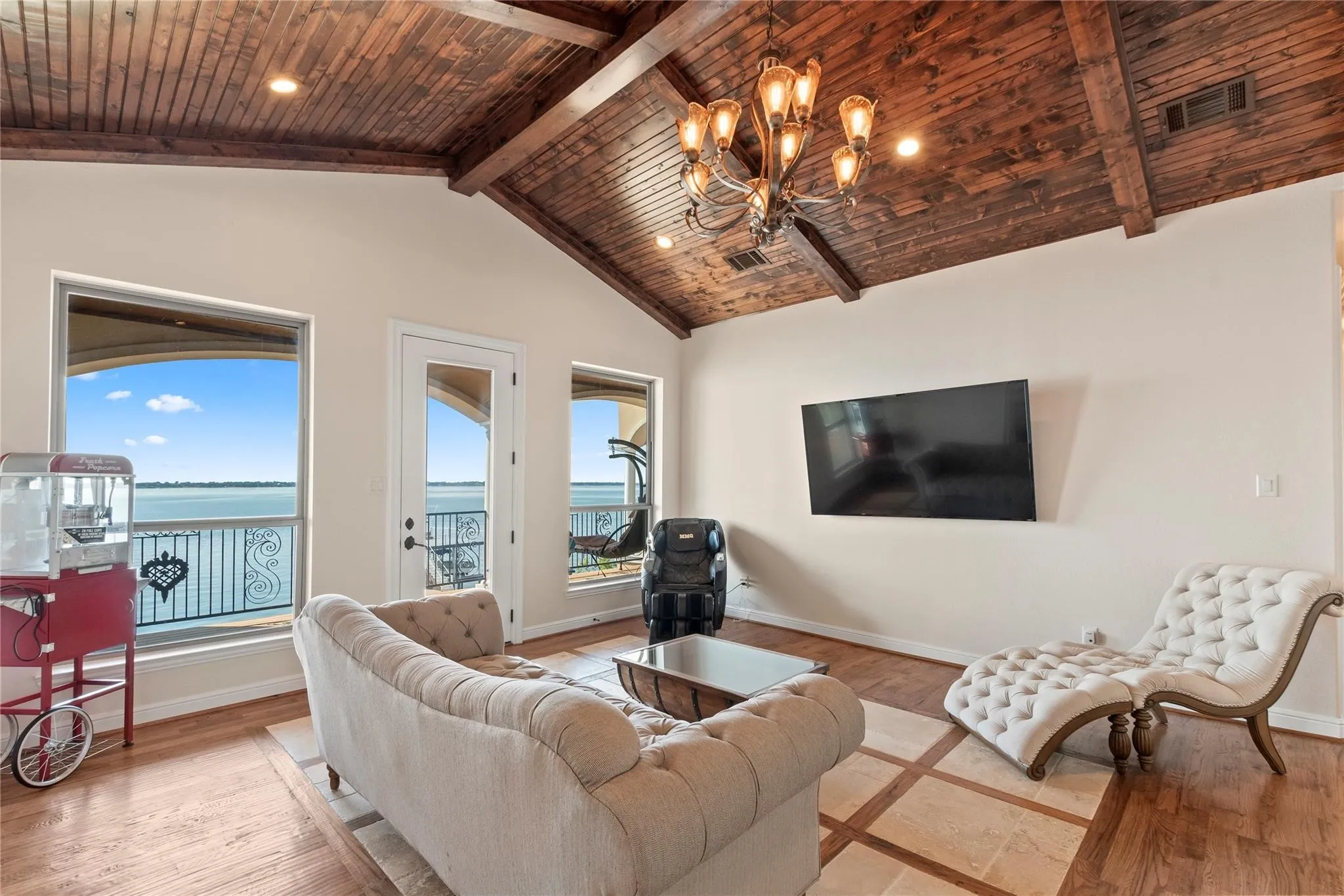 Bonus room with wood floors and wet bar and balcony access perfect for second living or game room