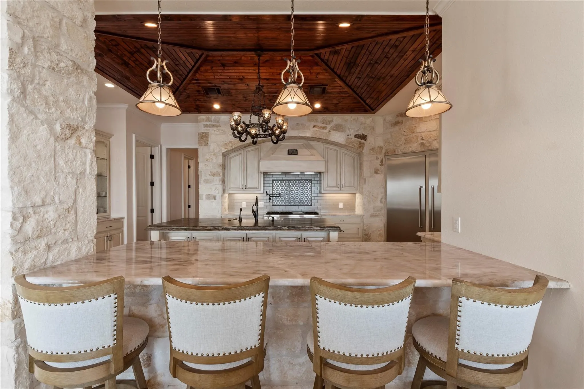Bar seating connects the kitchen with the dining and living areas
