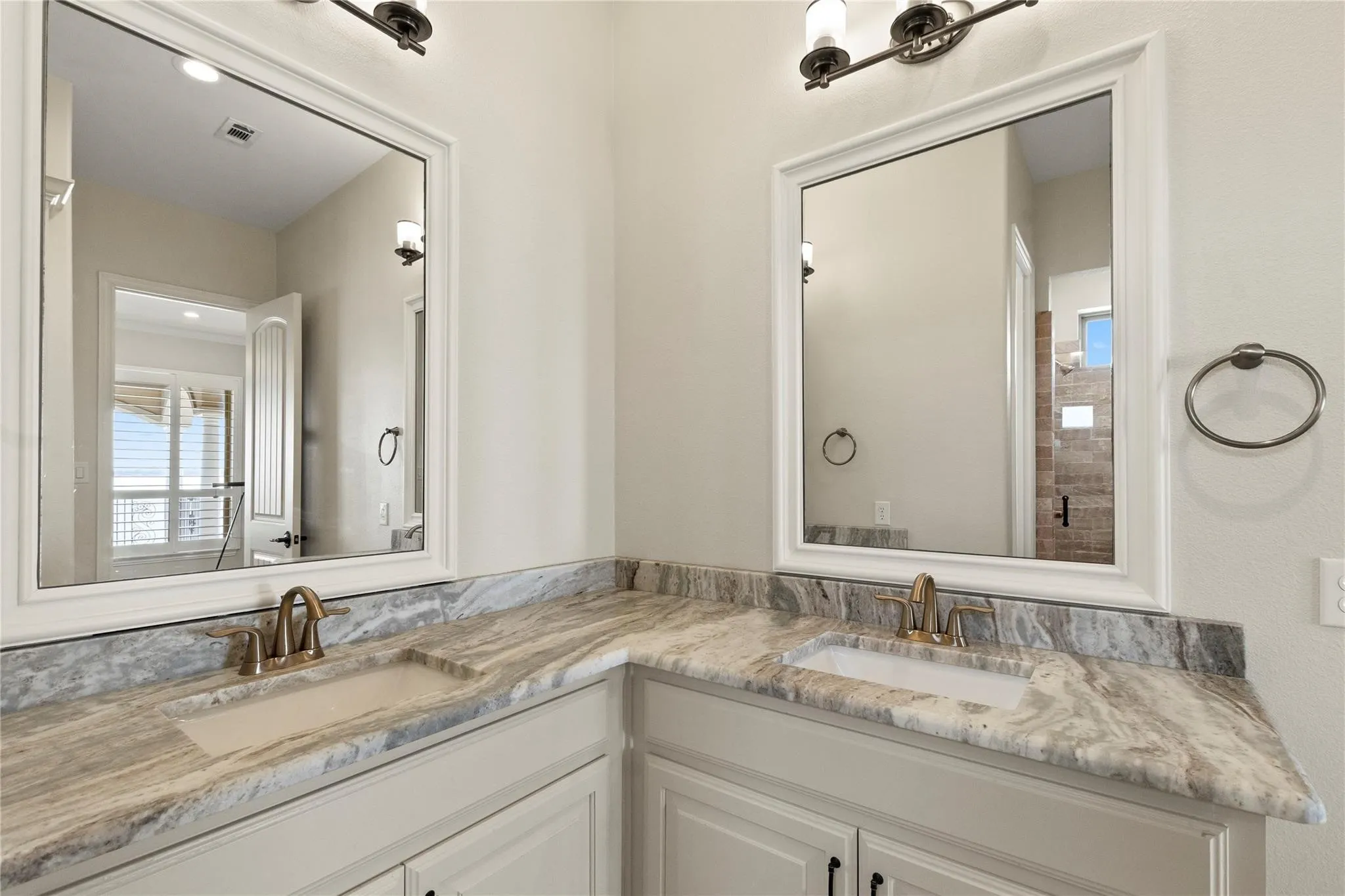 Ensuite bath with double sink vanity and walk in shower for bedroom 3