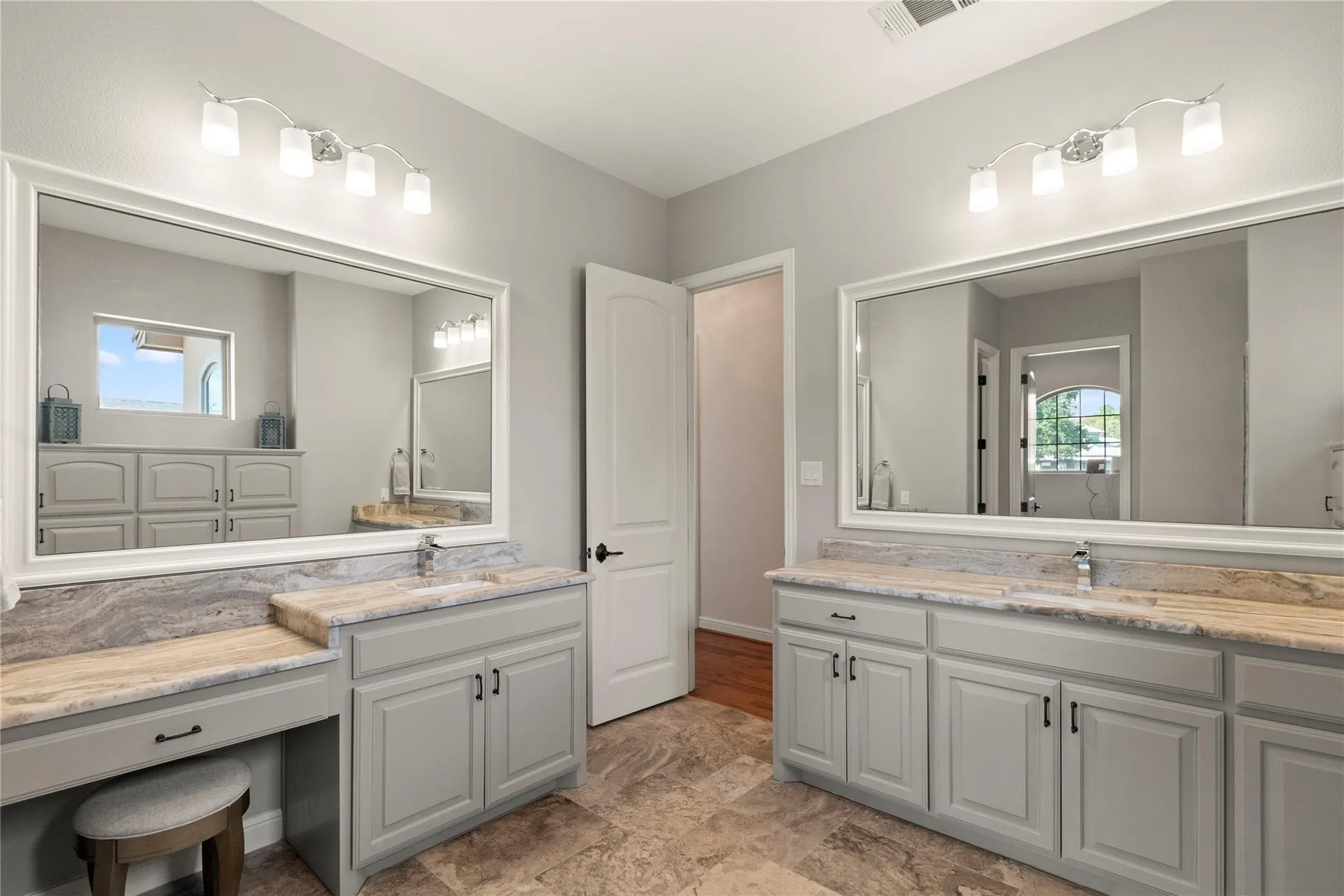 Sixth Bathroom with separate vanities, large walk in shower opening to an exercise room