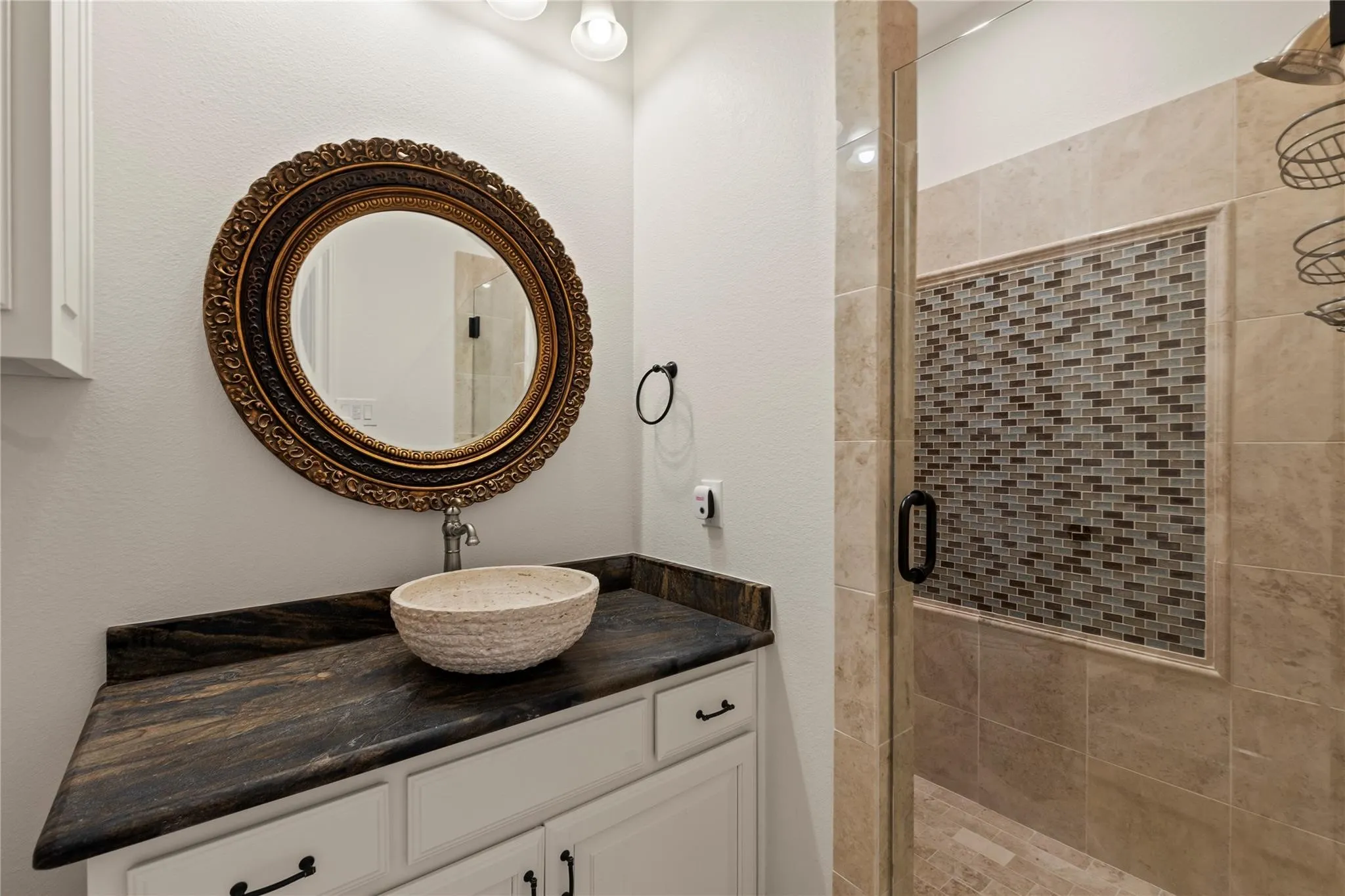 Downstairs guest full second bathroom next to office with walk-in shower offers comfort and flexibility for visitors.