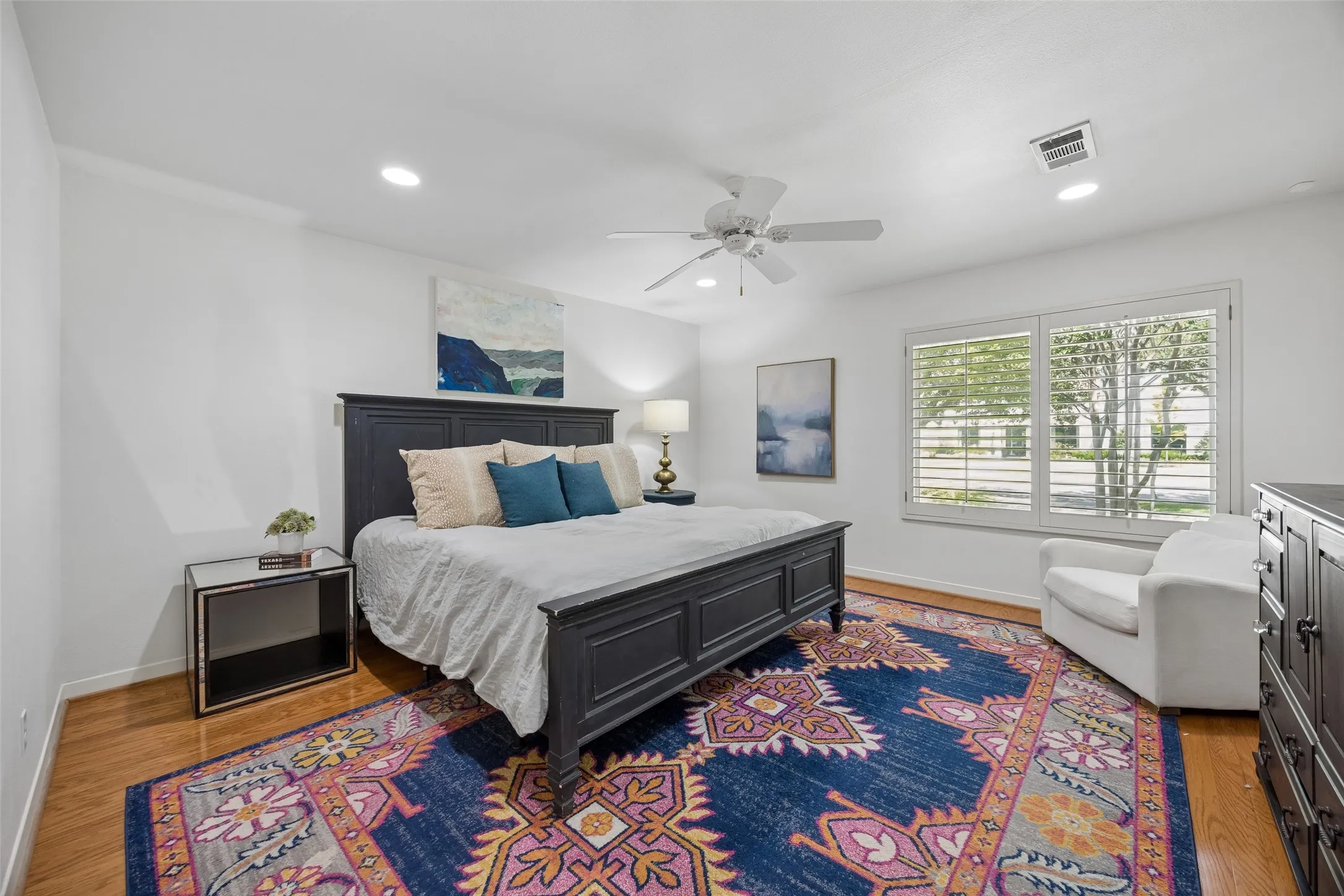 The spacious downstairs primary suite is located on the opposite side of the house from all other bedrooms with great features including wood floors, spacious walk-in closet and room for a sitting area. Ensuite bathroom attached.
