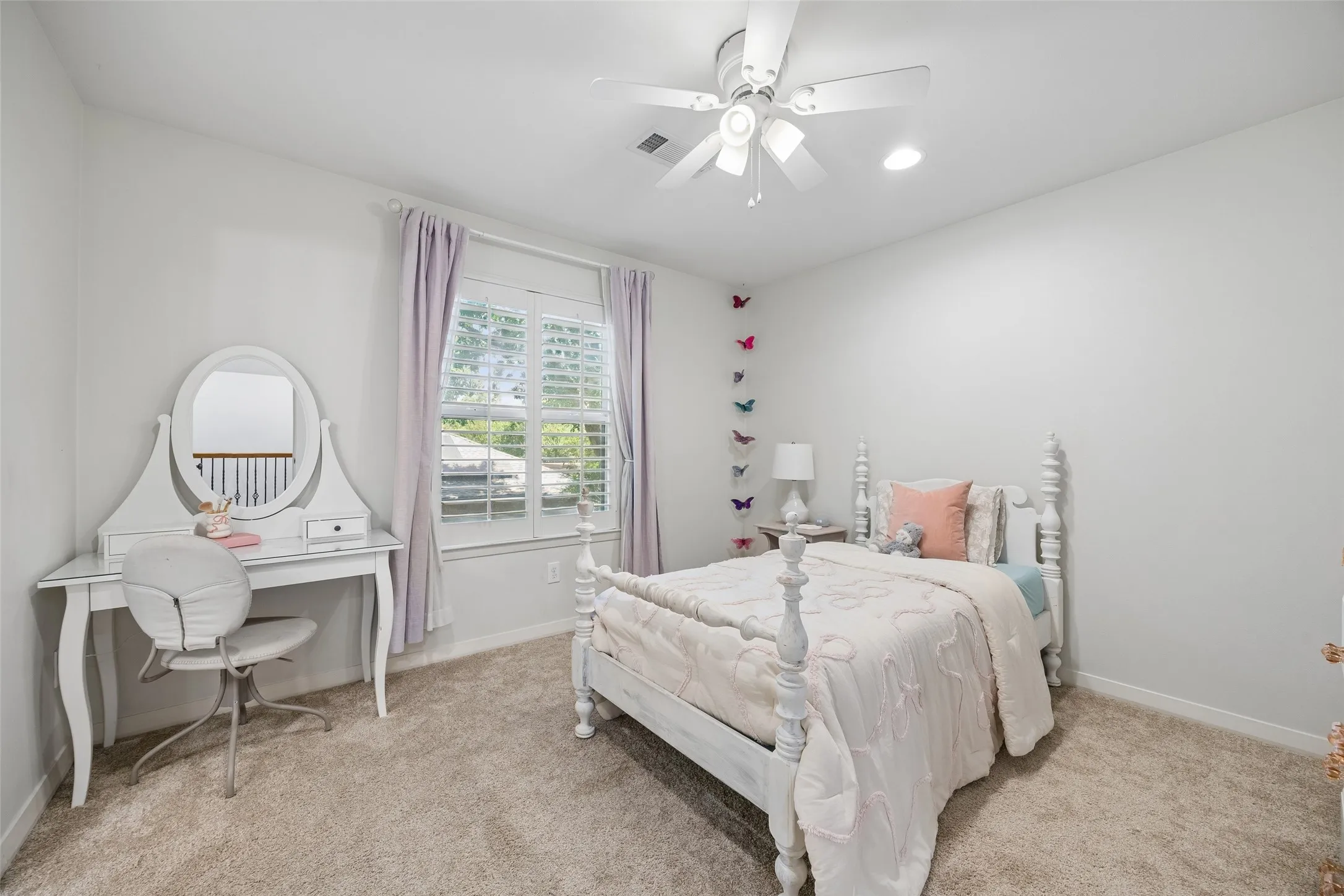 A bright upstairs bedroom offers generous space, soft natural light, and access to the adjoining Jack-and-Jill bath.