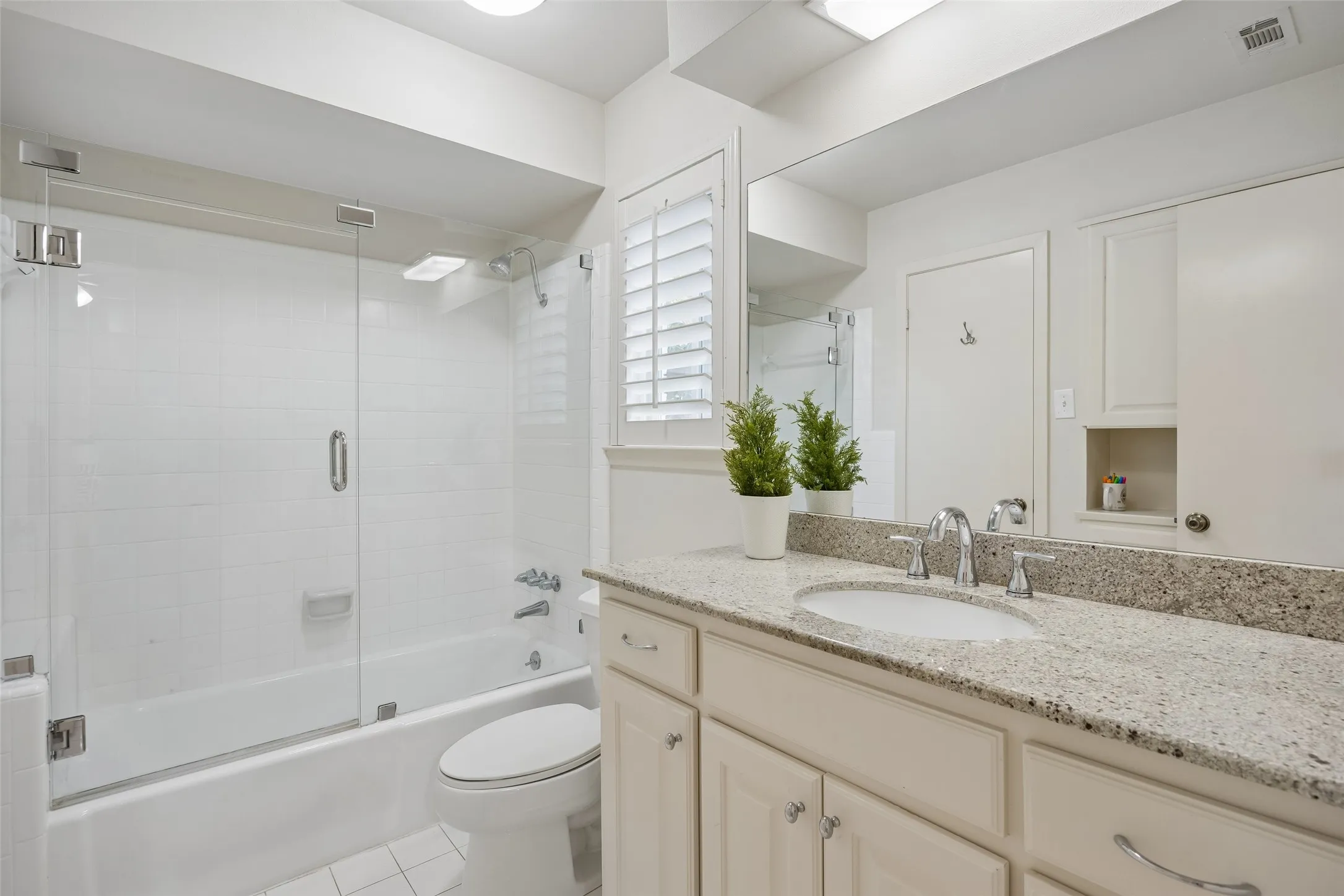 Downstairs Jack and Jill bathroom connecting a guest bedroom and office currently being used as an office.