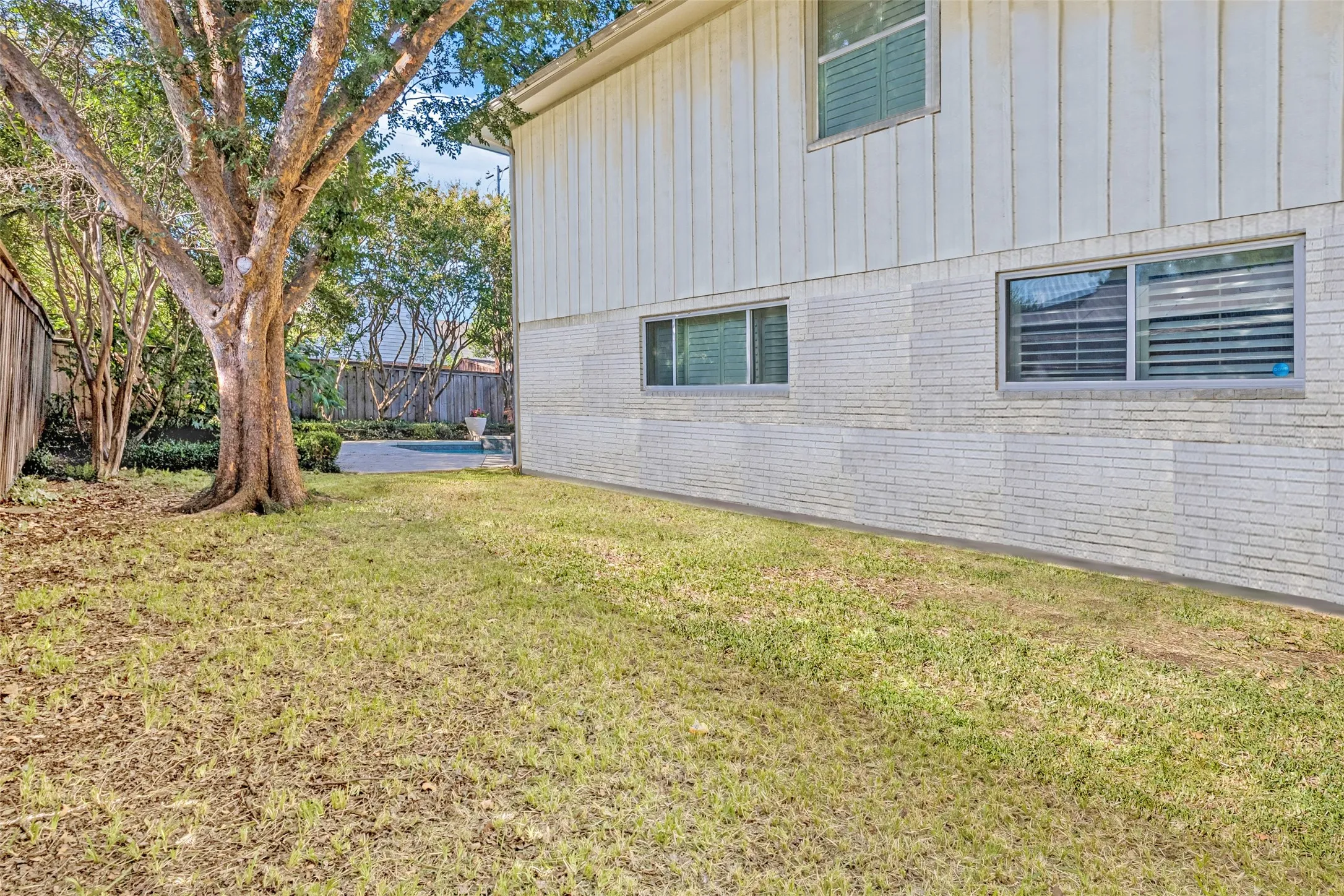 Spacious side yard offers incredible potential.