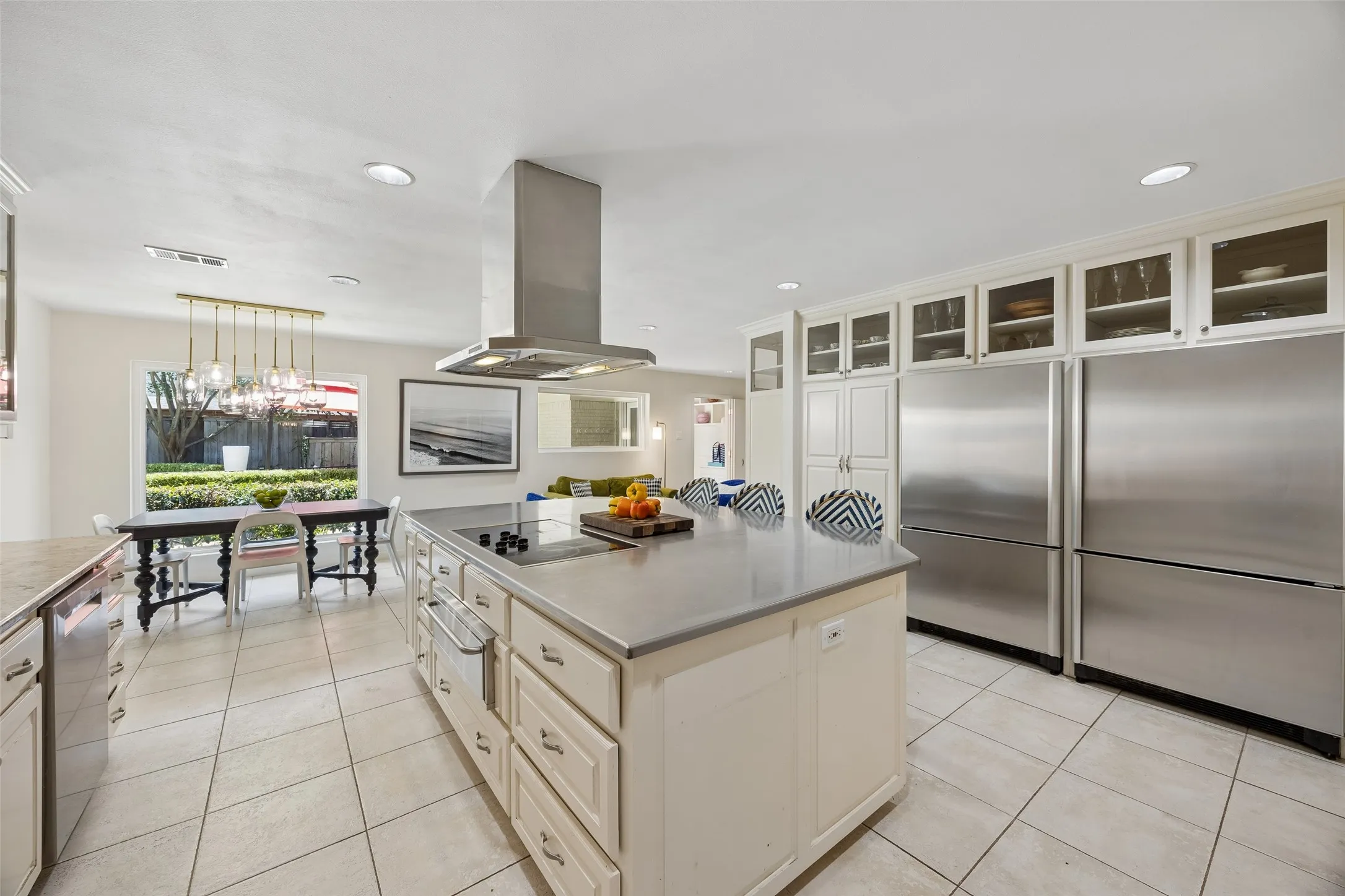 Additional views of the spacious kithcen with oversized built-in refrigerator and freezer, 5 burner cooktop and warming drawer.