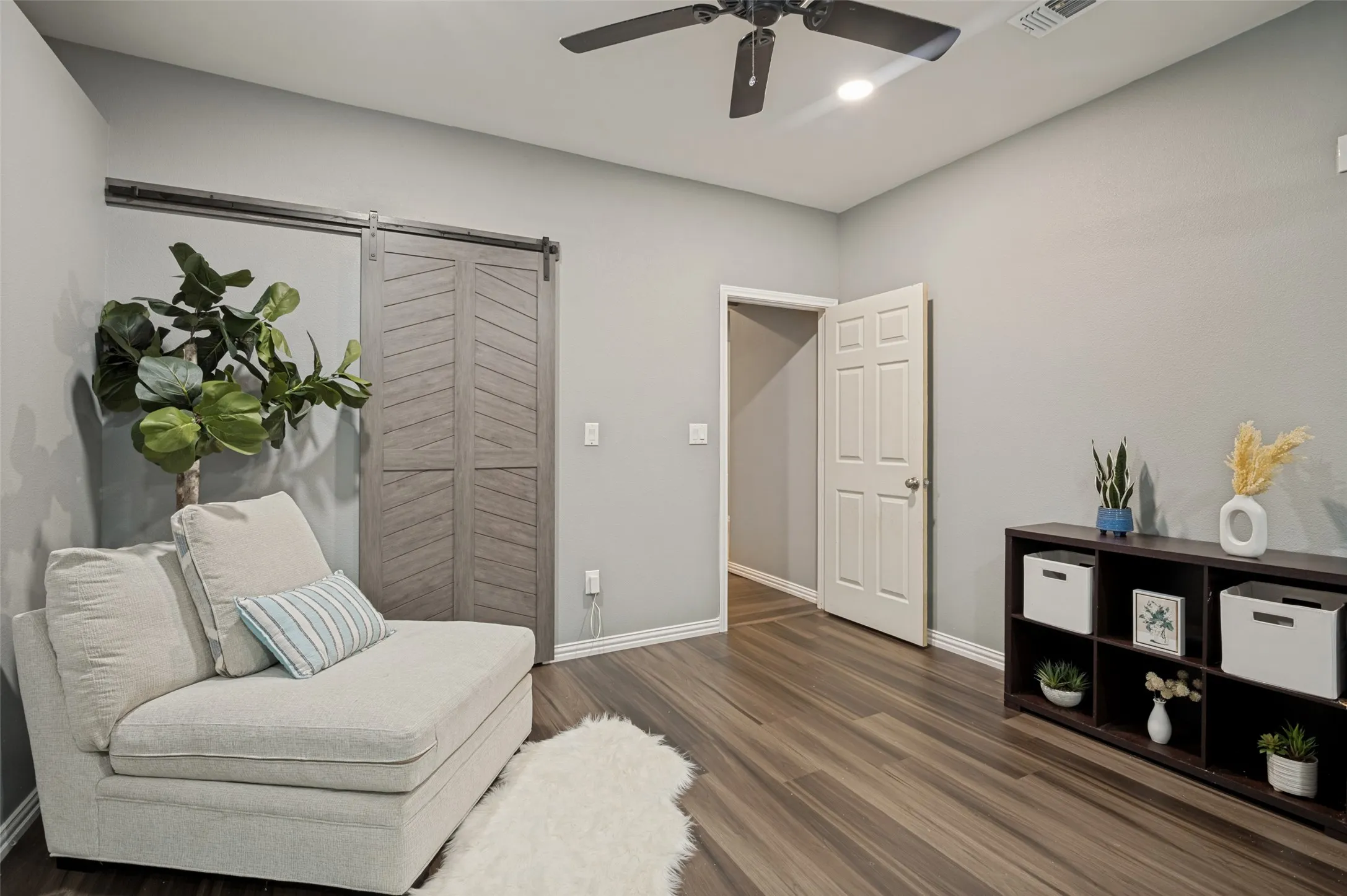 Bedroom with extra sitting space and huge closet for storage.