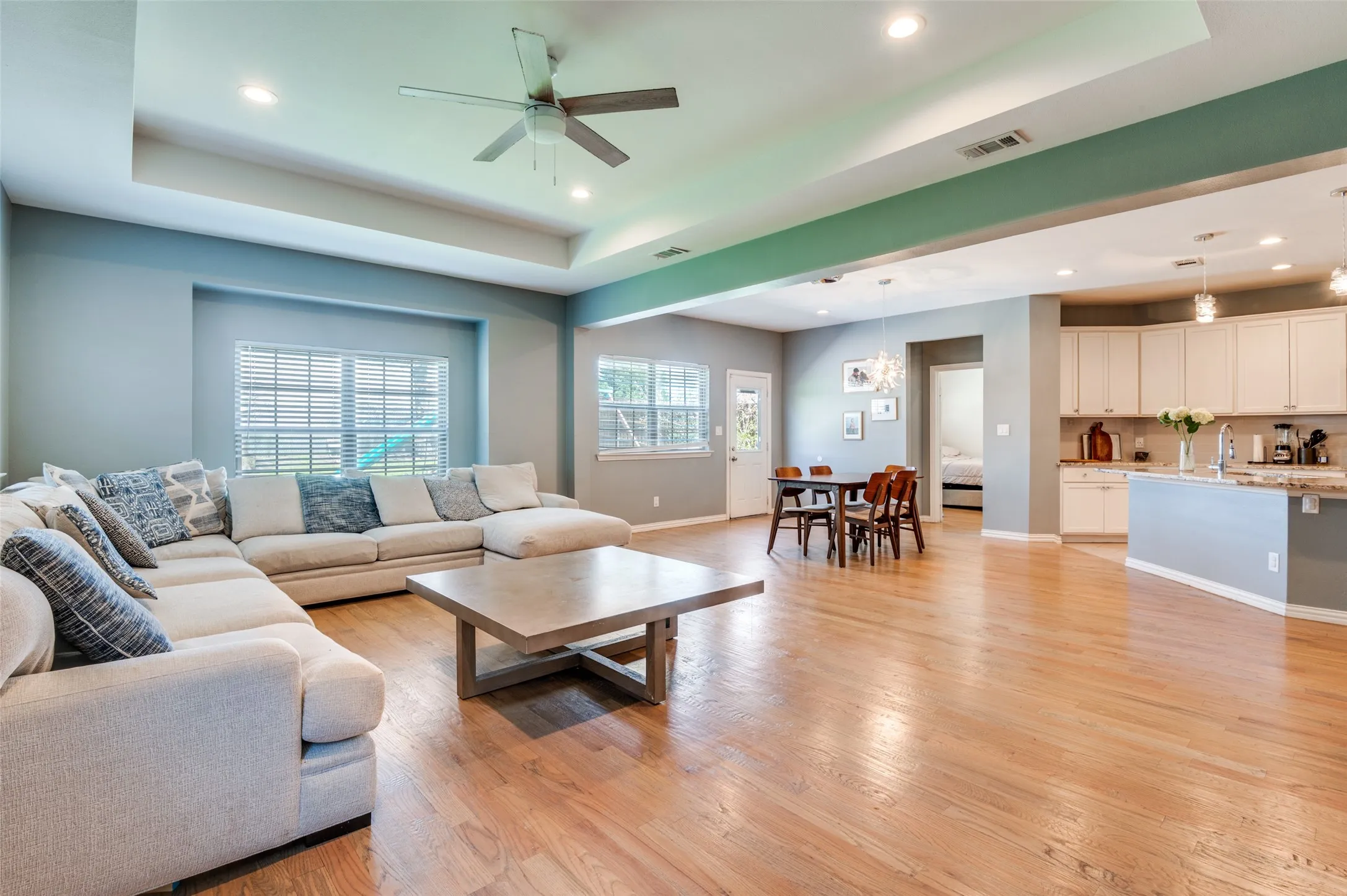 Another angle of the large living area opening to the kitchen/dining.