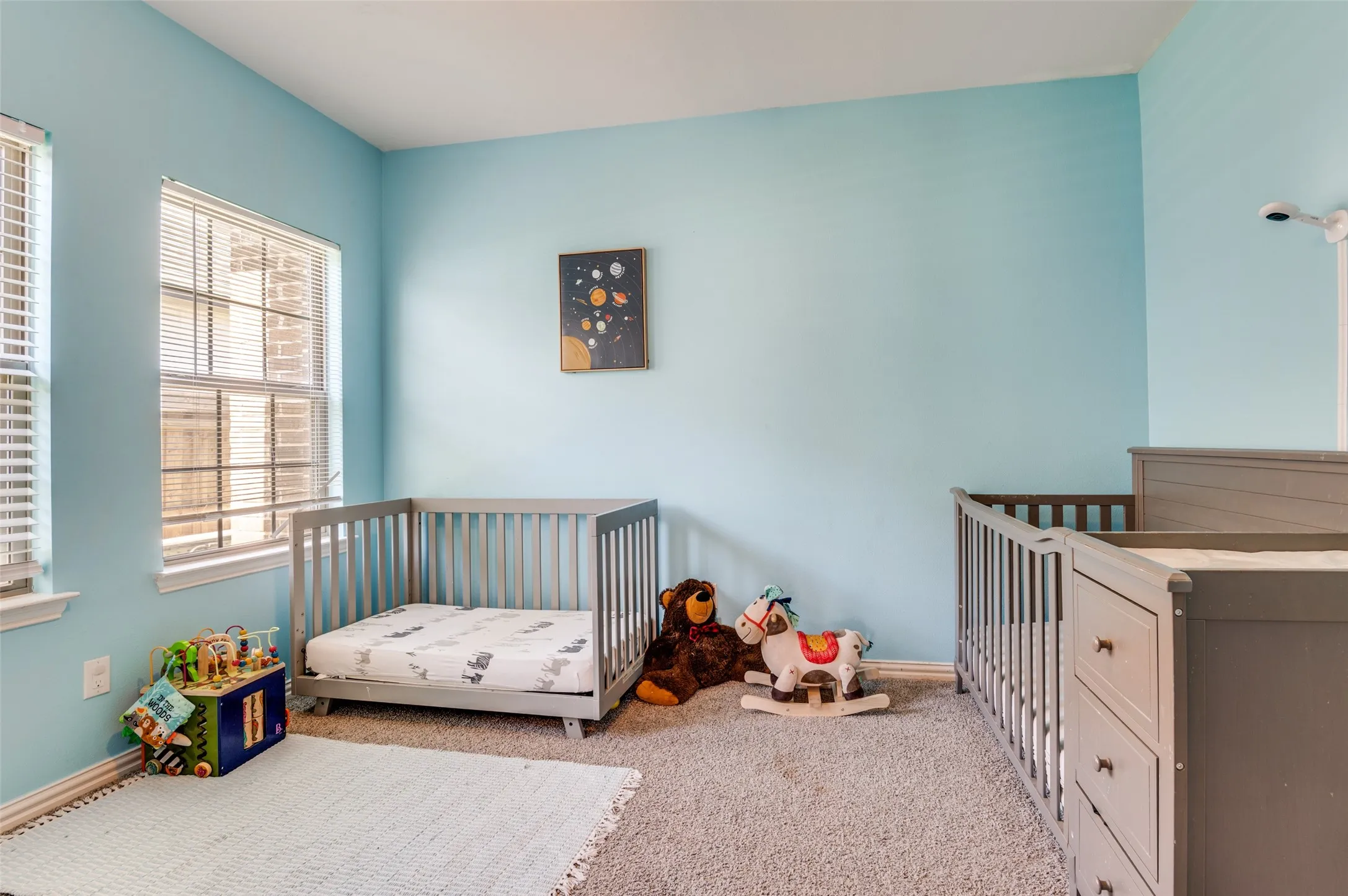Roomy bedroom with lots of natural light.