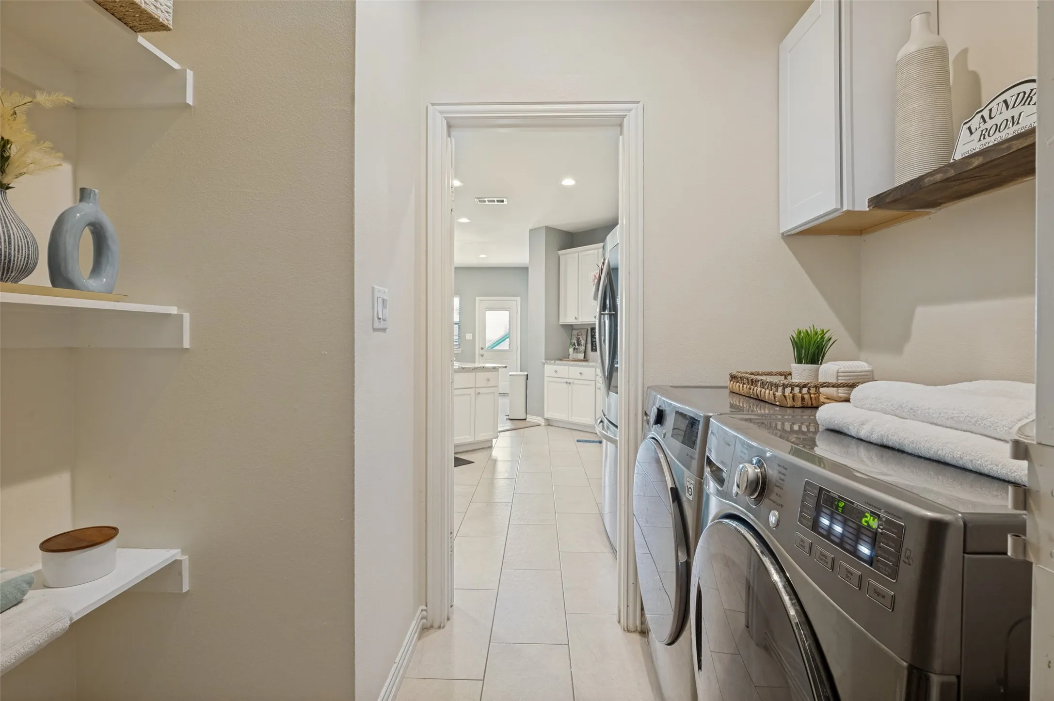 Beautiful and large laundry room with lots of storage space