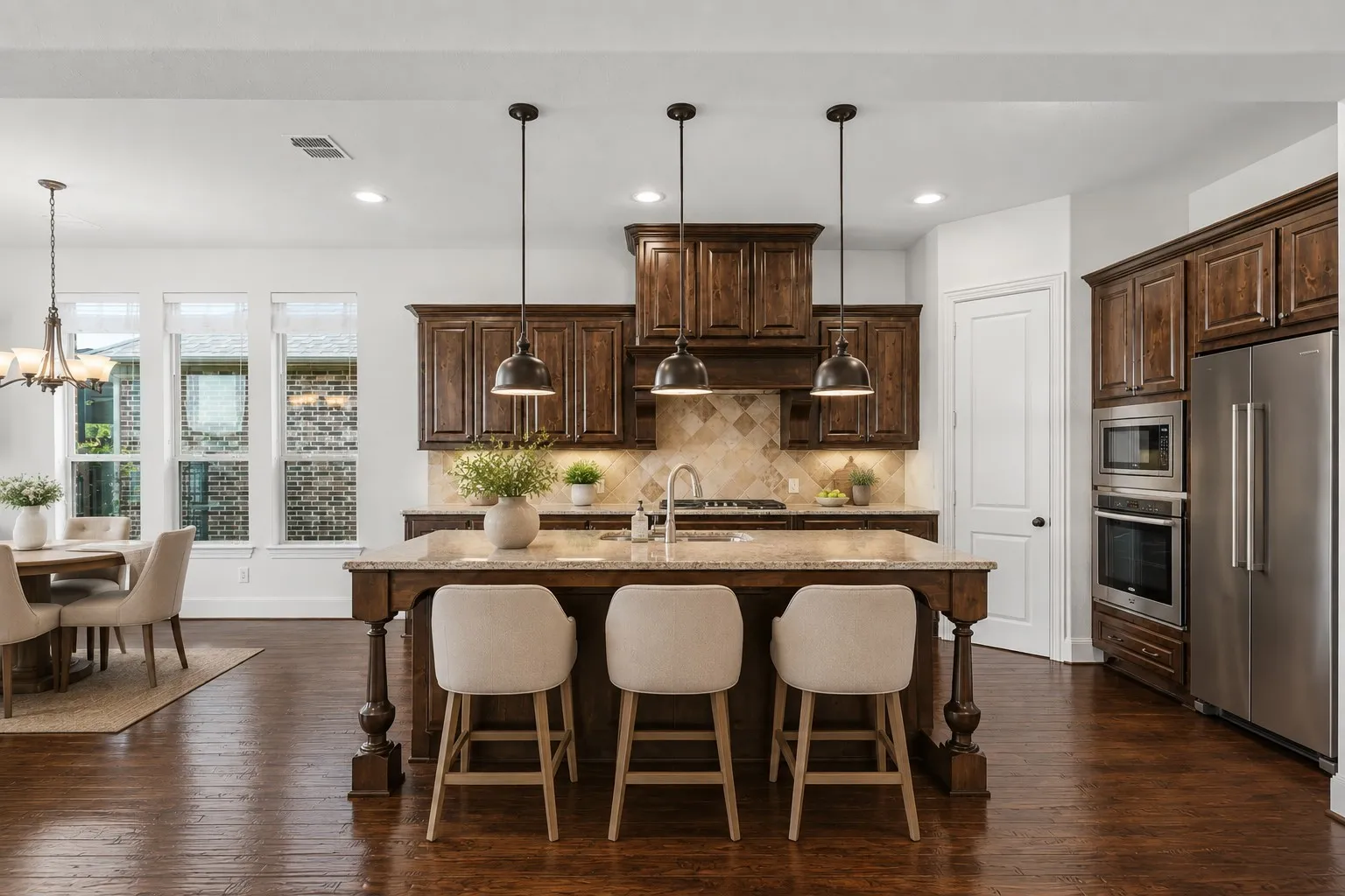 Granite counters, gas cooktop and stainless appliances-virtually staged