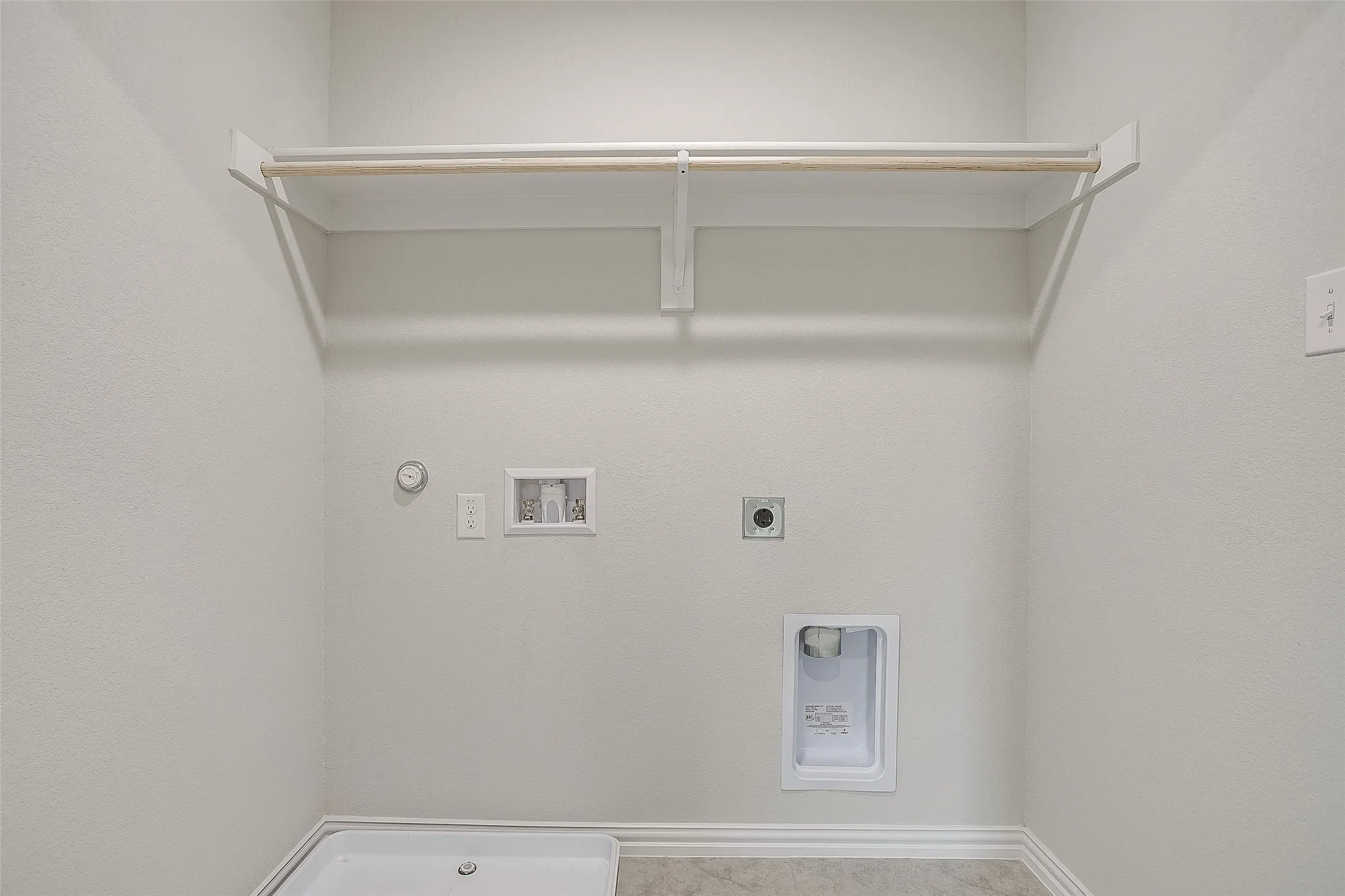 Laundry area featuring gas dryer hookup, hookup for a washing machine, and electric dryer hookup