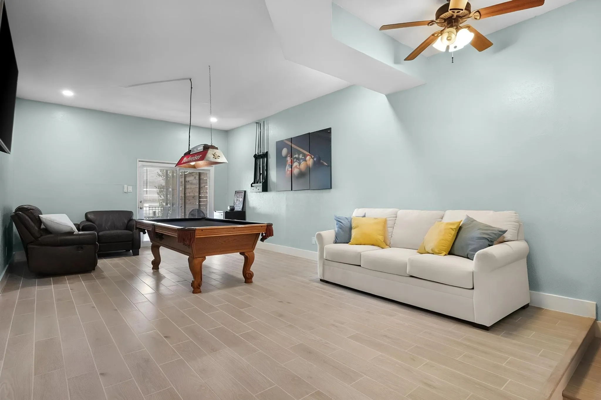 Recessed lighting, wood-finish flooring, ceiling fan, and sliding glass door